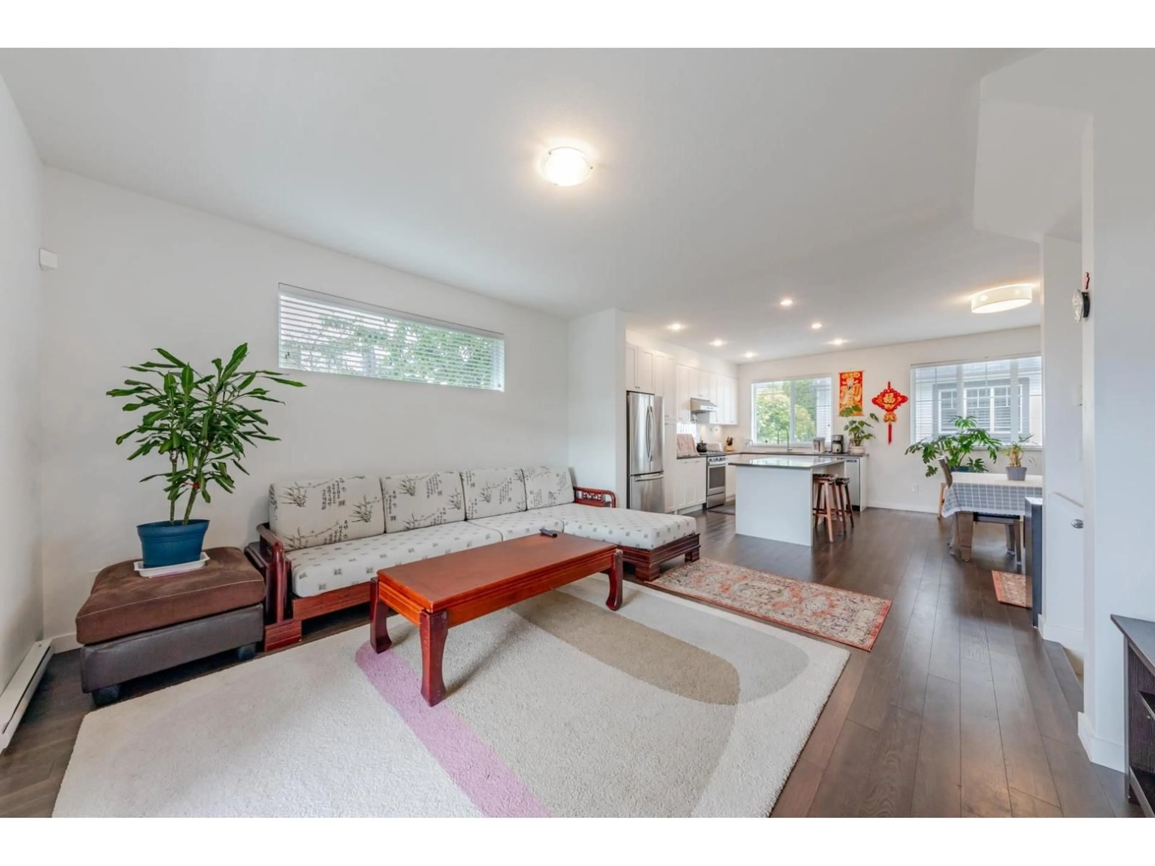 Living room with furniture, wood/laminate floor for 28 - 16337 15, Surrey British Columbia V4A0C3