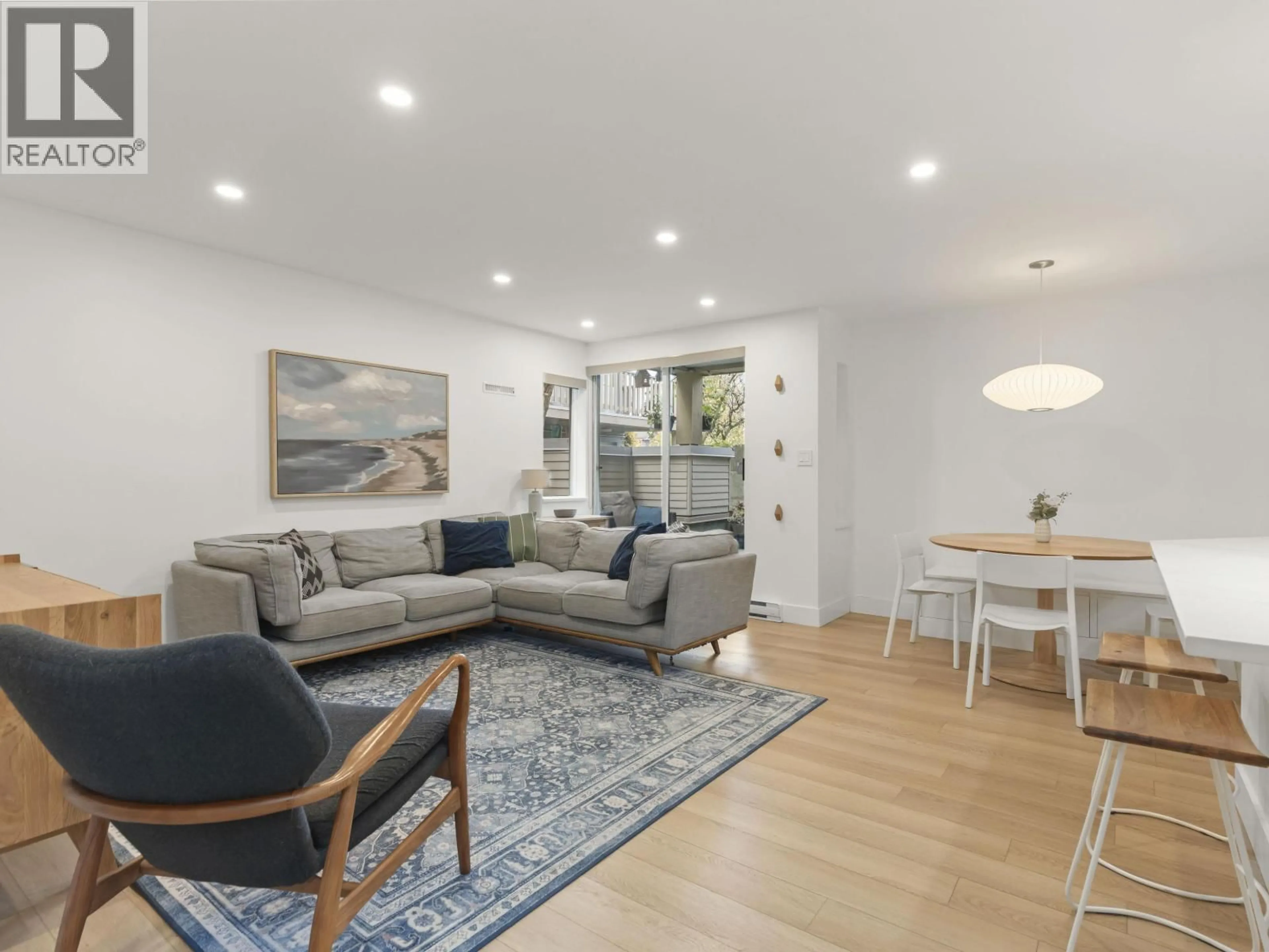 Living room with furniture, wood/laminate floor for 116 - 1890 6TH AVENUE, Vancouver British Columbia V6J1R6