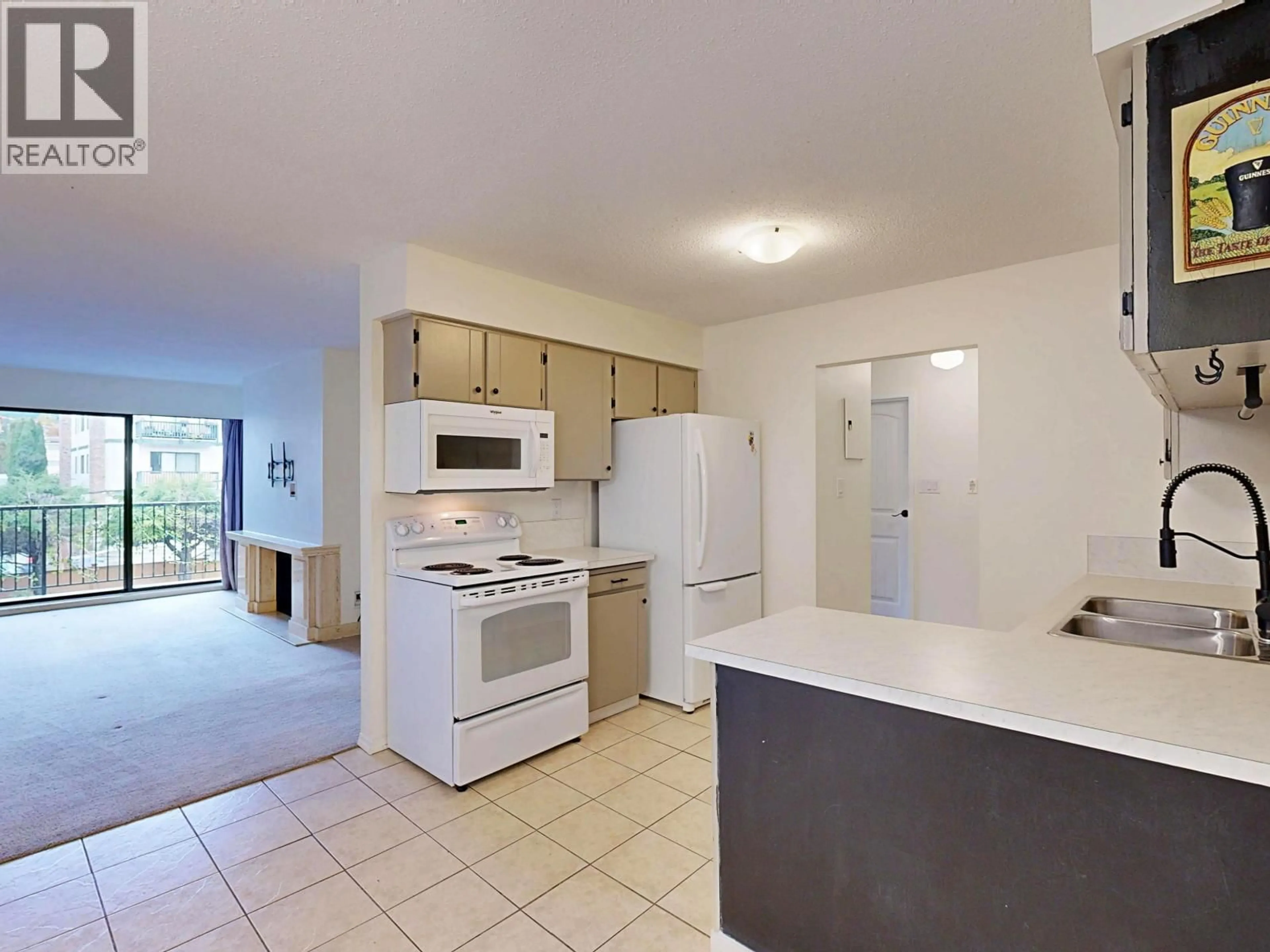 Standard kitchen, ceramic/tile floor for 206 - 138 18TH STREET, North Vancouver British Columbia V7M1W4