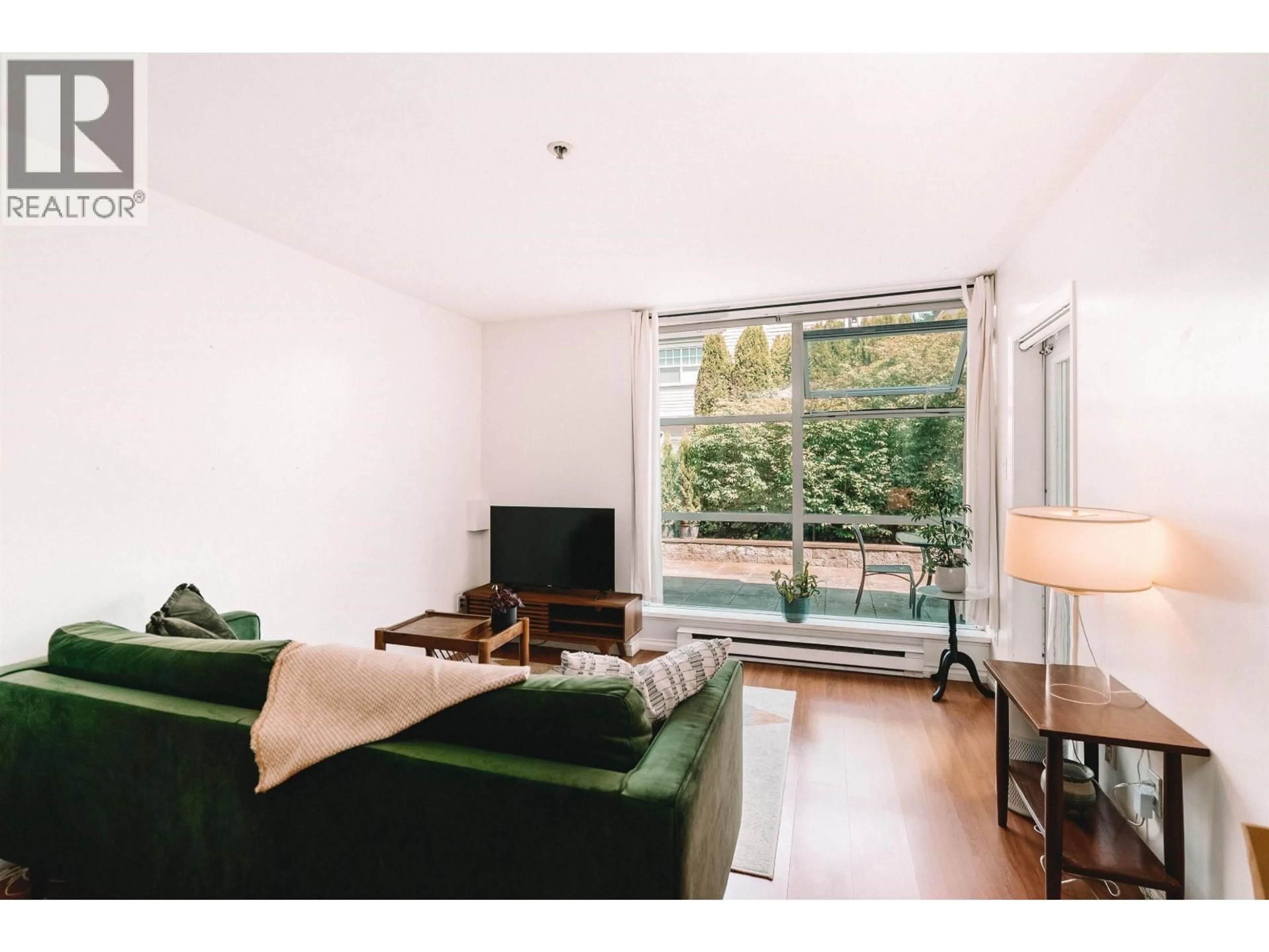 Living room with furniture, wood/laminate floor for 106 - 3168 LAUREL STREET, Vancouver British Columbia V5Z3T8