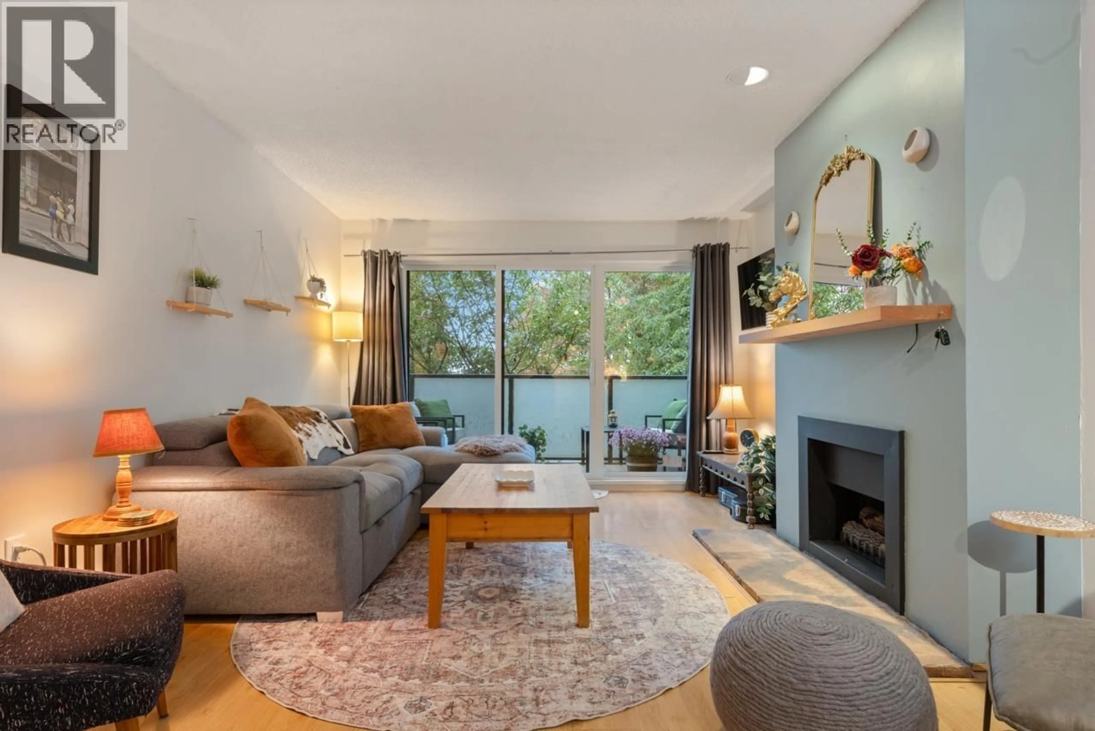 Living room with furniture, wood/laminate floor for 208 - 1516 CHARLES STREET, Vancouver British Columbia V5L2T1