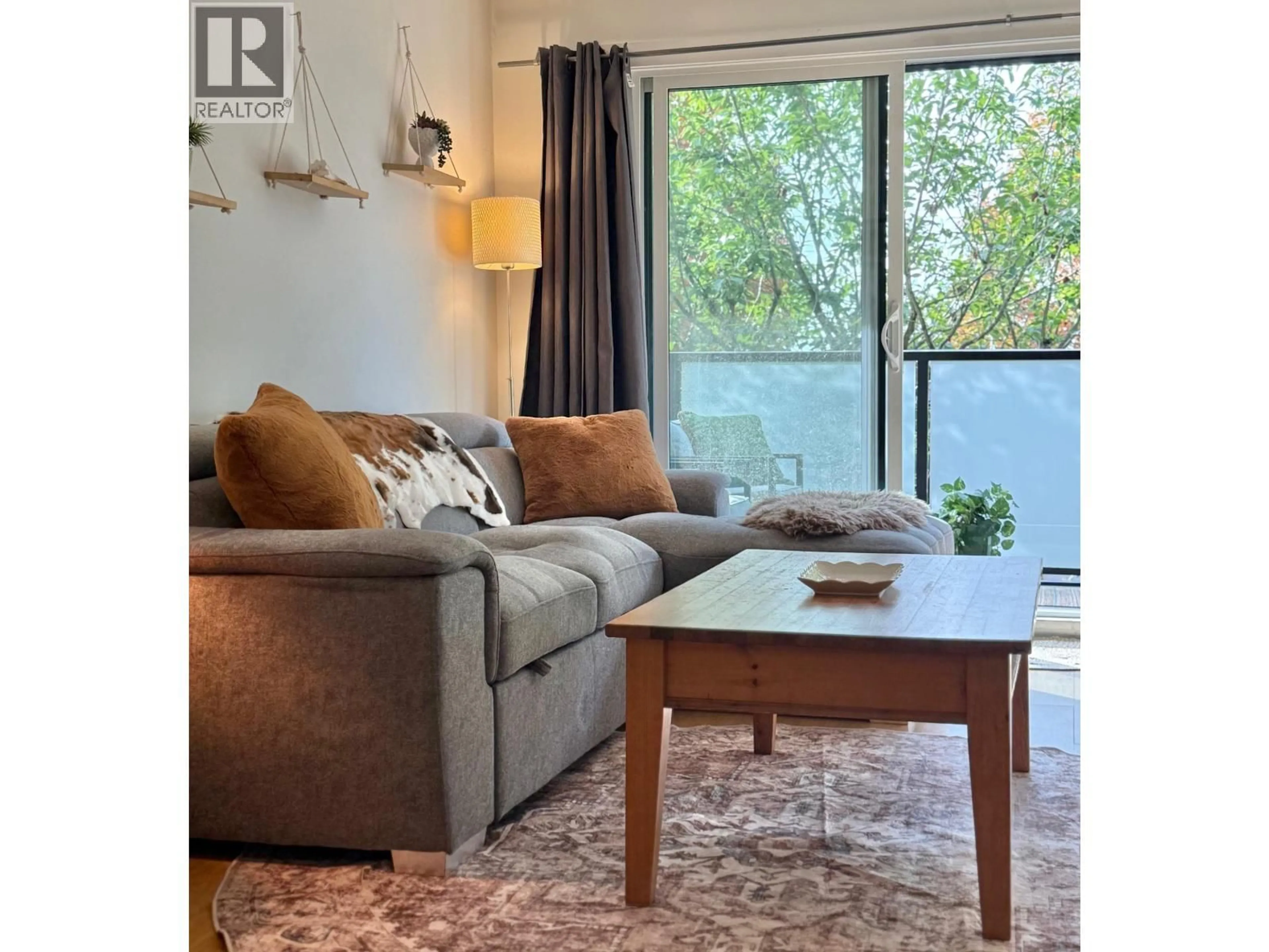 Living room with furniture, wood/laminate floor for 208 - 1516 CHARLES STREET, Vancouver British Columbia V5L2T1