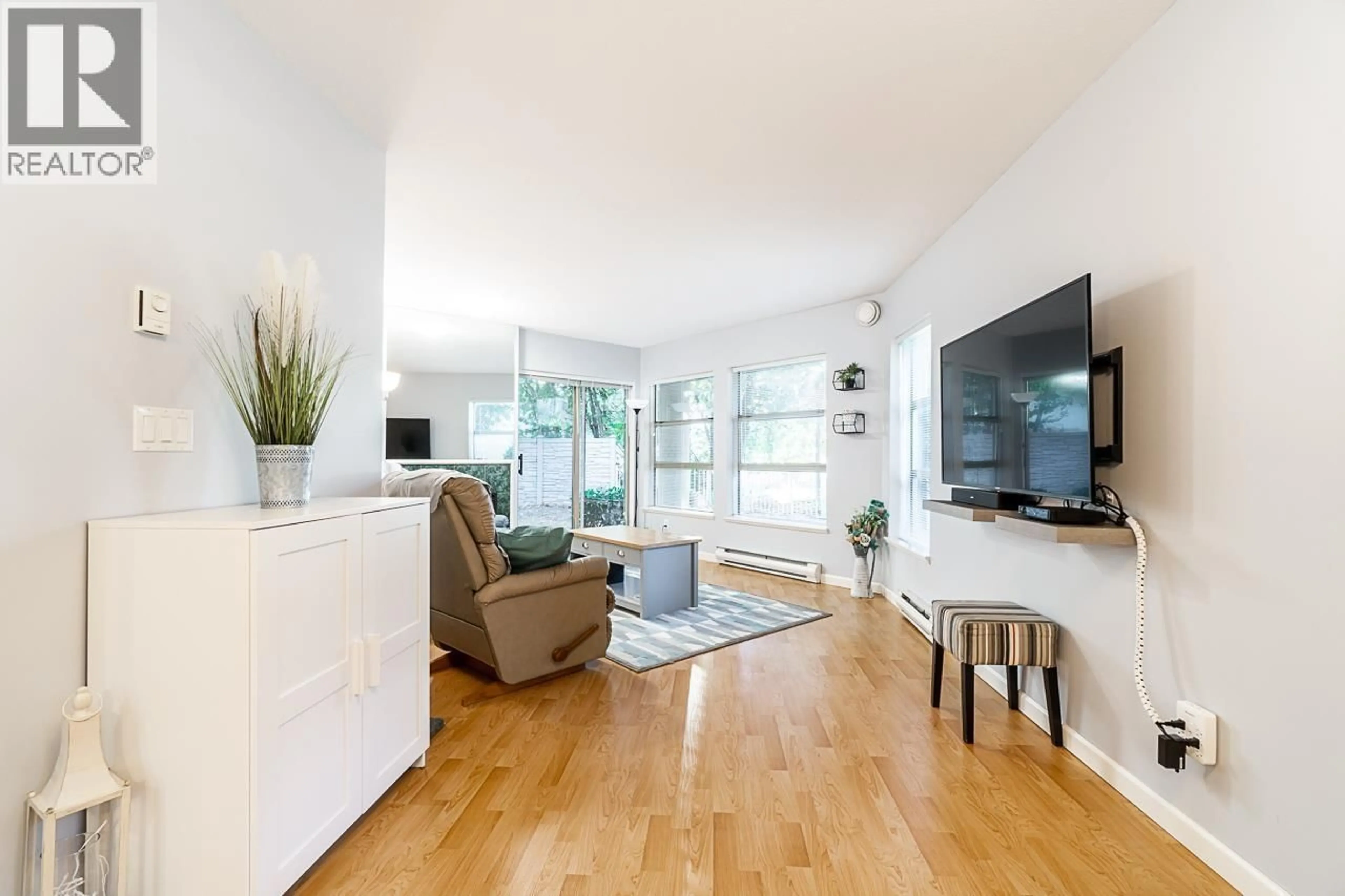 Living room with furniture, wood/laminate floor for 101 - 22277 122 AVENUE, Maple Ridge British Columbia V2X3X8