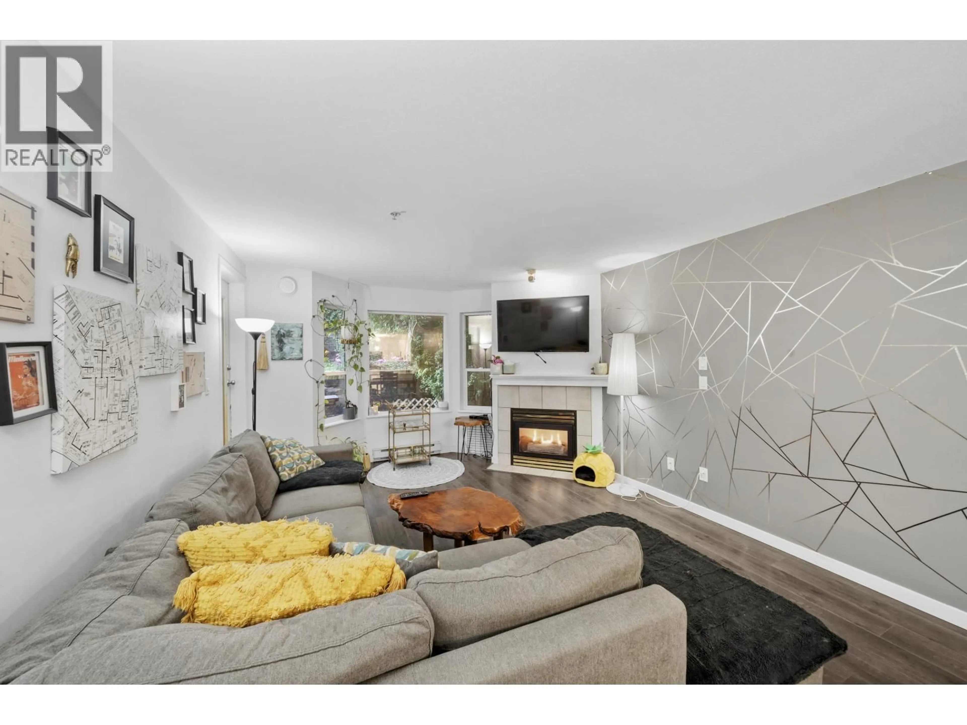 Living room with furniture, unknown for 311 - 121 SHORELINE CIRCLE, Port Moody British Columbia V3H5G2