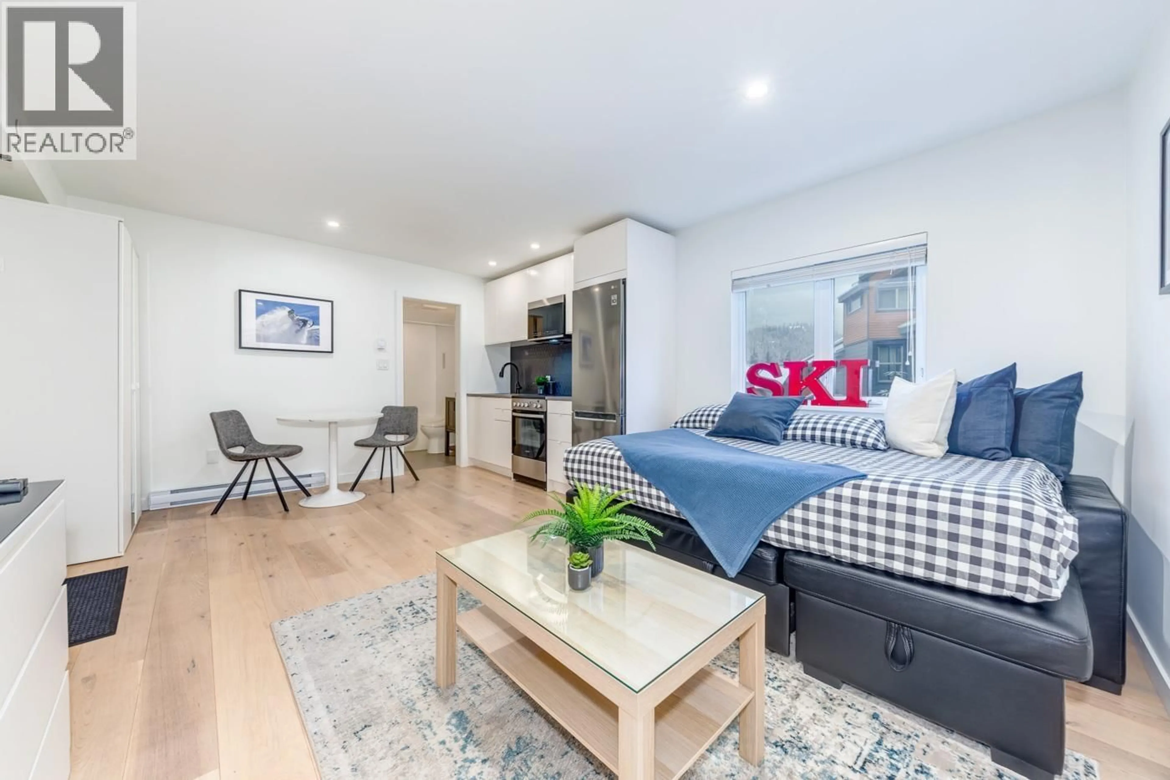 Living room with furniture, wood/laminate floor for 318 - 2111 WHISTLER ROAD, Whistler British Columbia V8E0A6