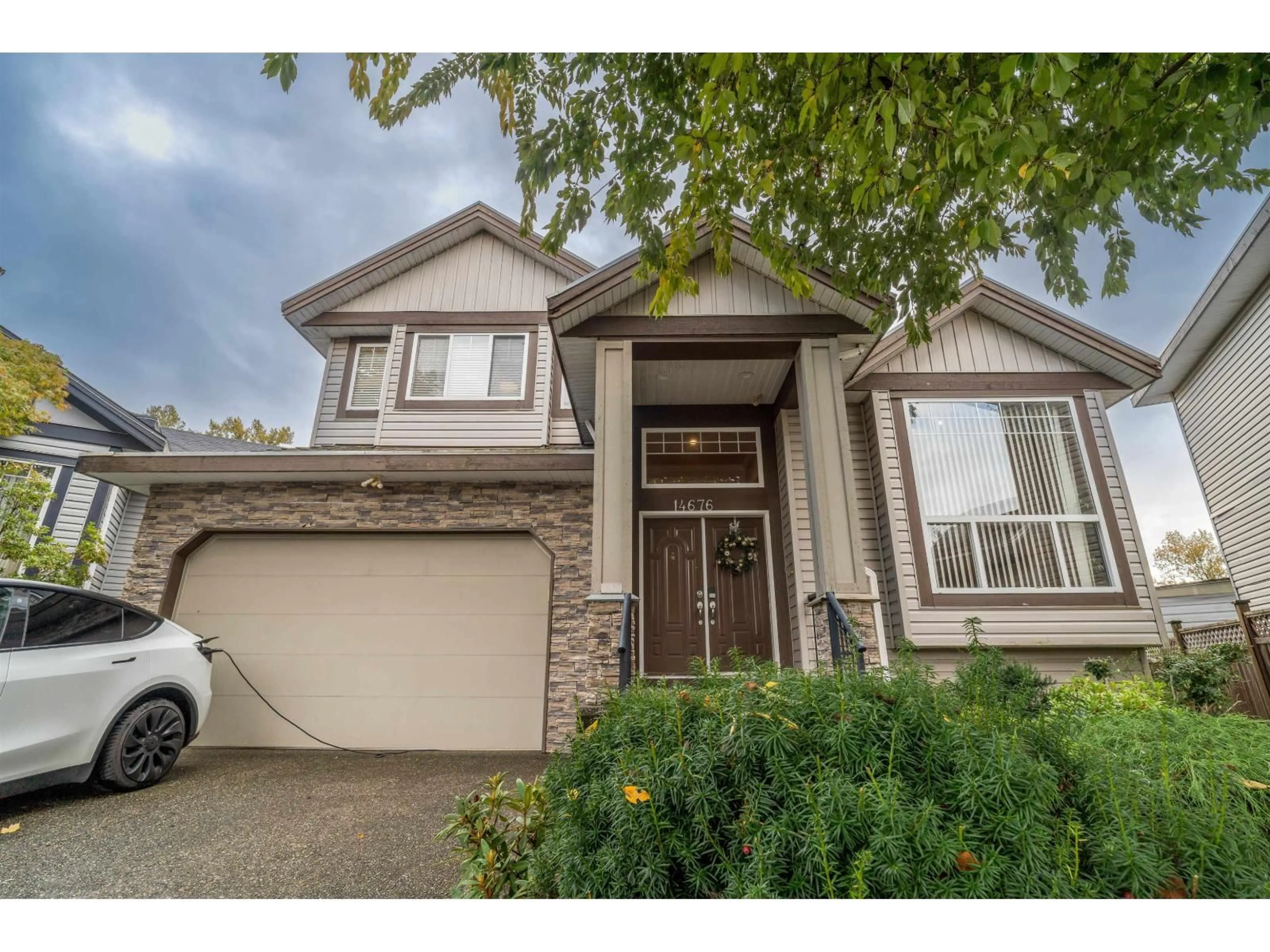 Home with vinyl exterior material, street for 14676 79, Surrey British Columbia V3S2W2