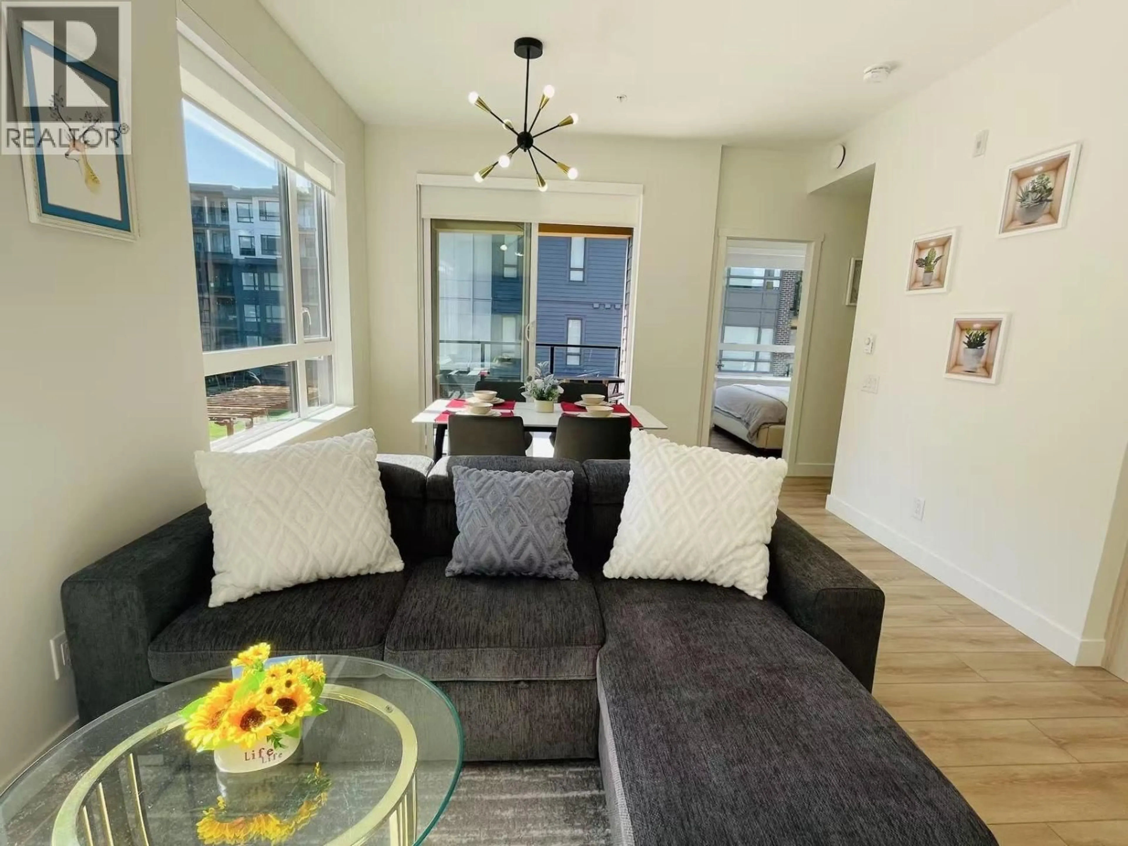 Living room with furniture, wood/laminate floor for 305 - 741 ANSKAR COURT, Coquitlam British Columbia V3J0N3