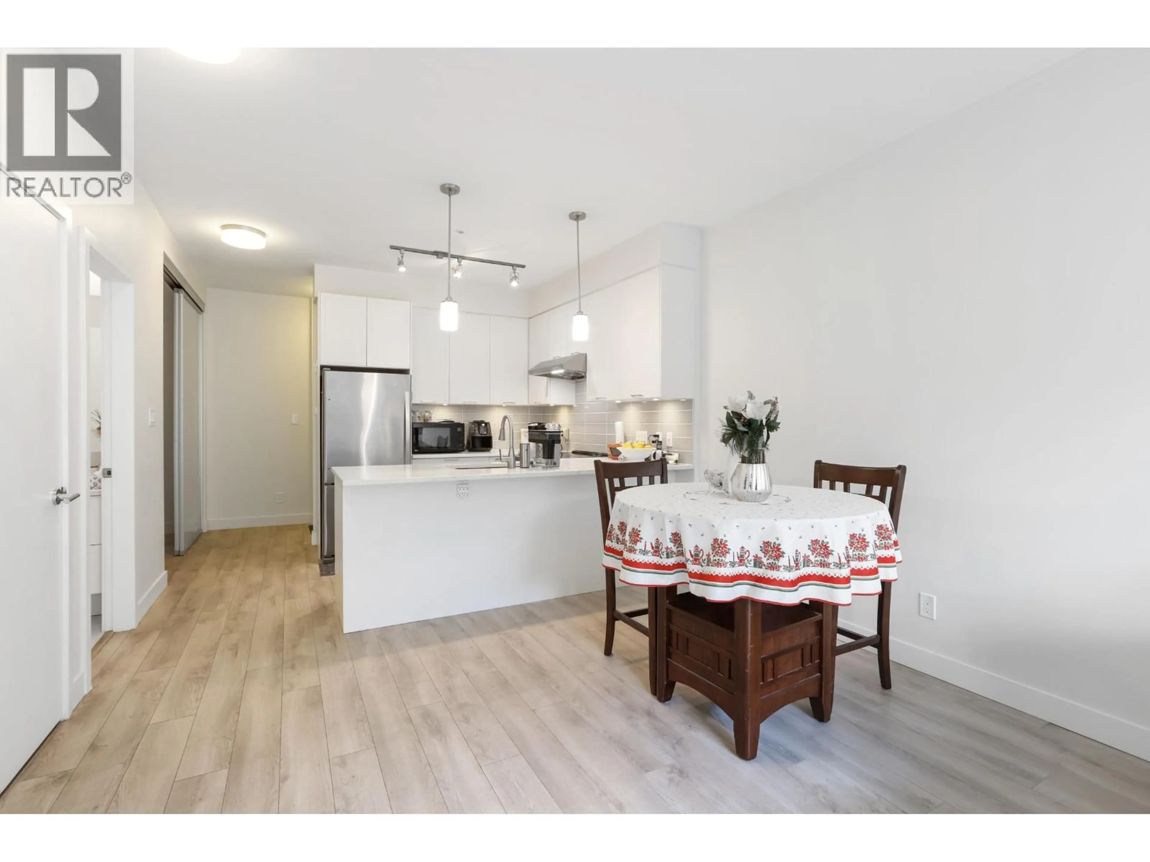 Open concept kitchen, wood/laminate floor for 106 - 828 GAUTHIER AVENUE, Coquitlam British Columbia V3K0E9