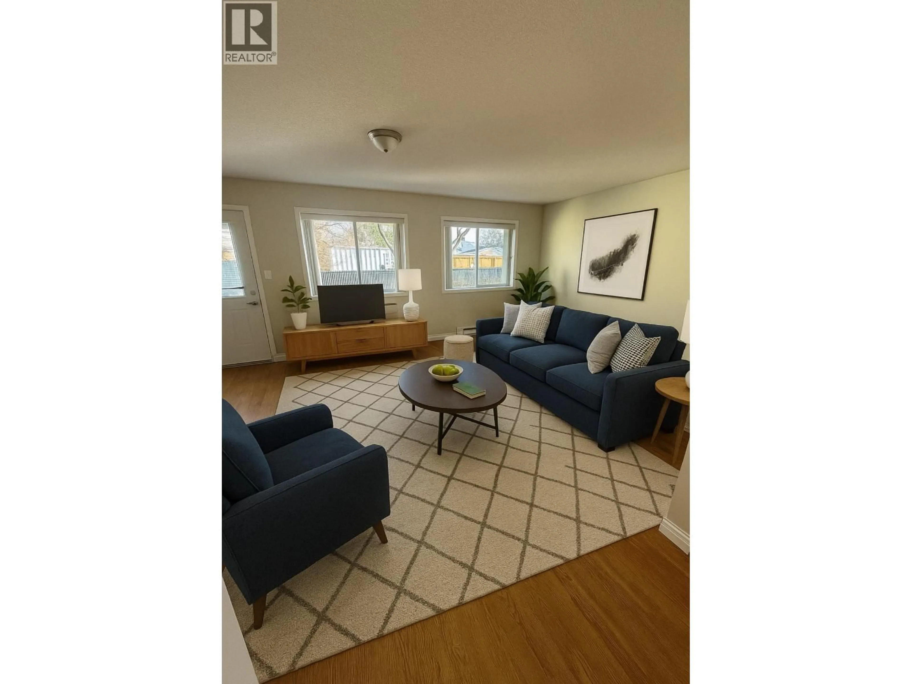 Living room with furniture, wood/laminate floor for 608 - 2877 FERRY AVENUE, Prince George British Columbia V2N1L3