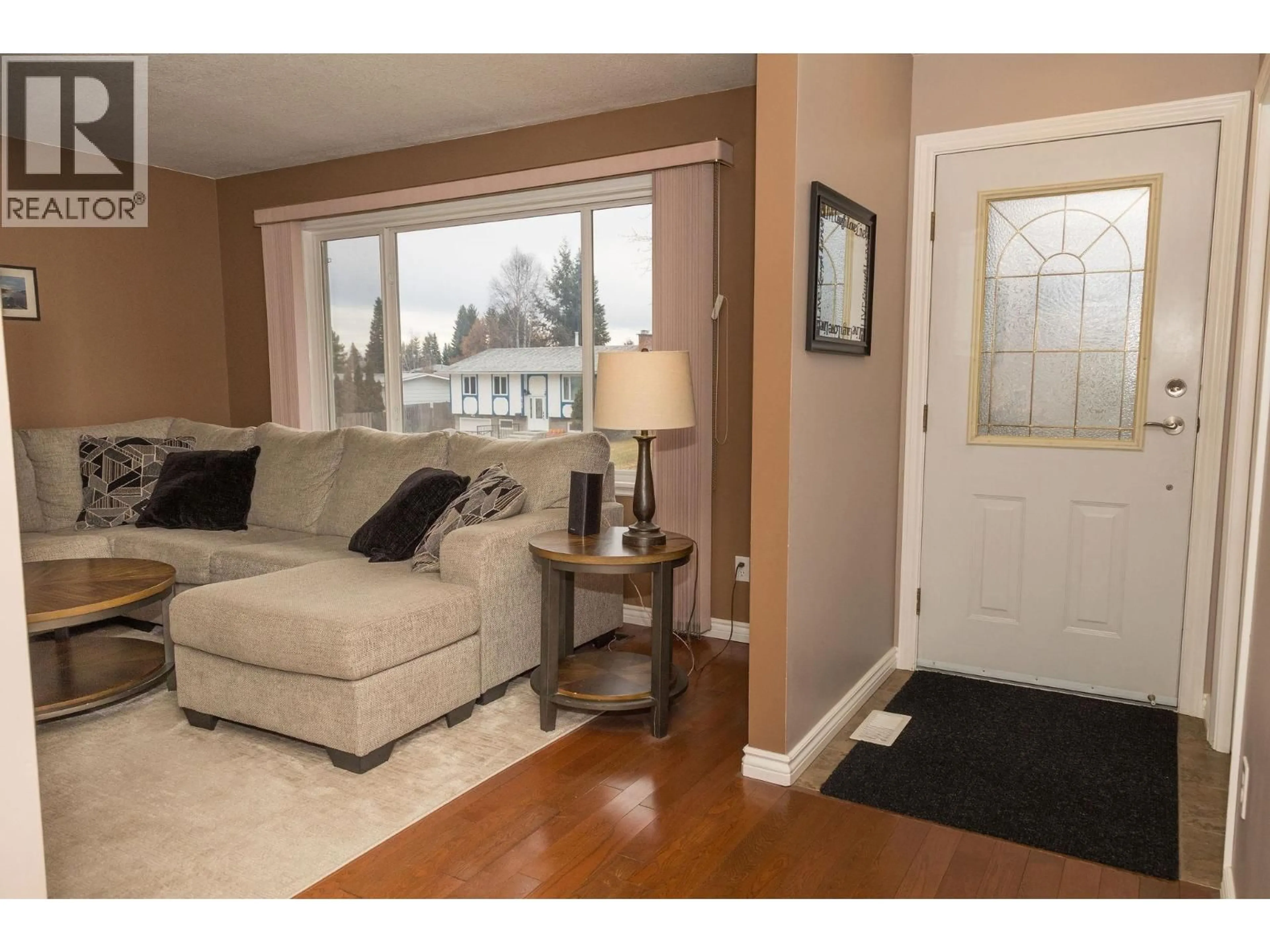 Living room with furniture, wood/laminate floor for 4176 NEHRING AVENUE, Prince George British Columbia V2N3G1