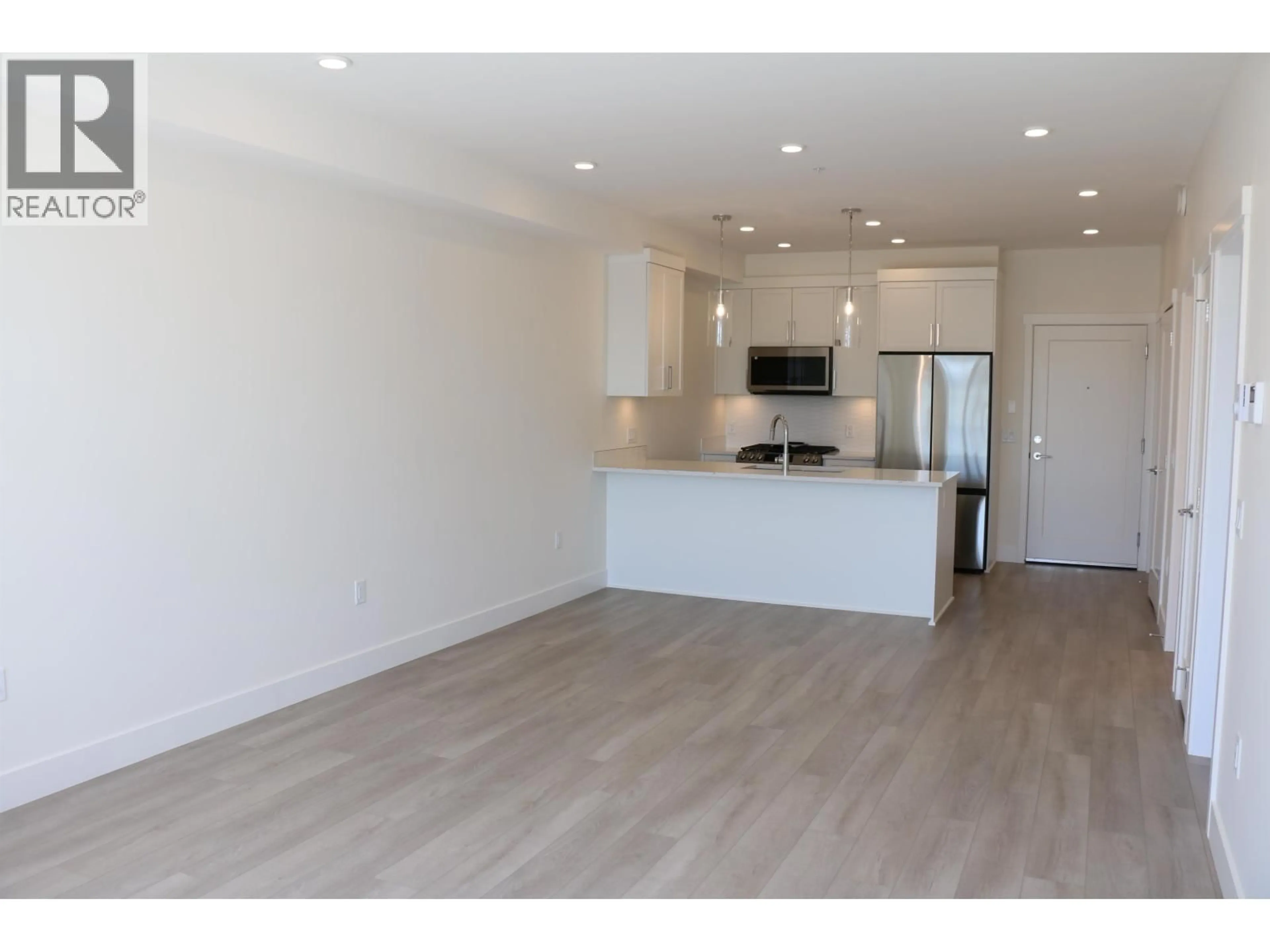Open concept kitchen, wood/laminate floor for 308 - 22633 SELKIRK AVENUE, Maple Ridge British Columbia V2X1C7