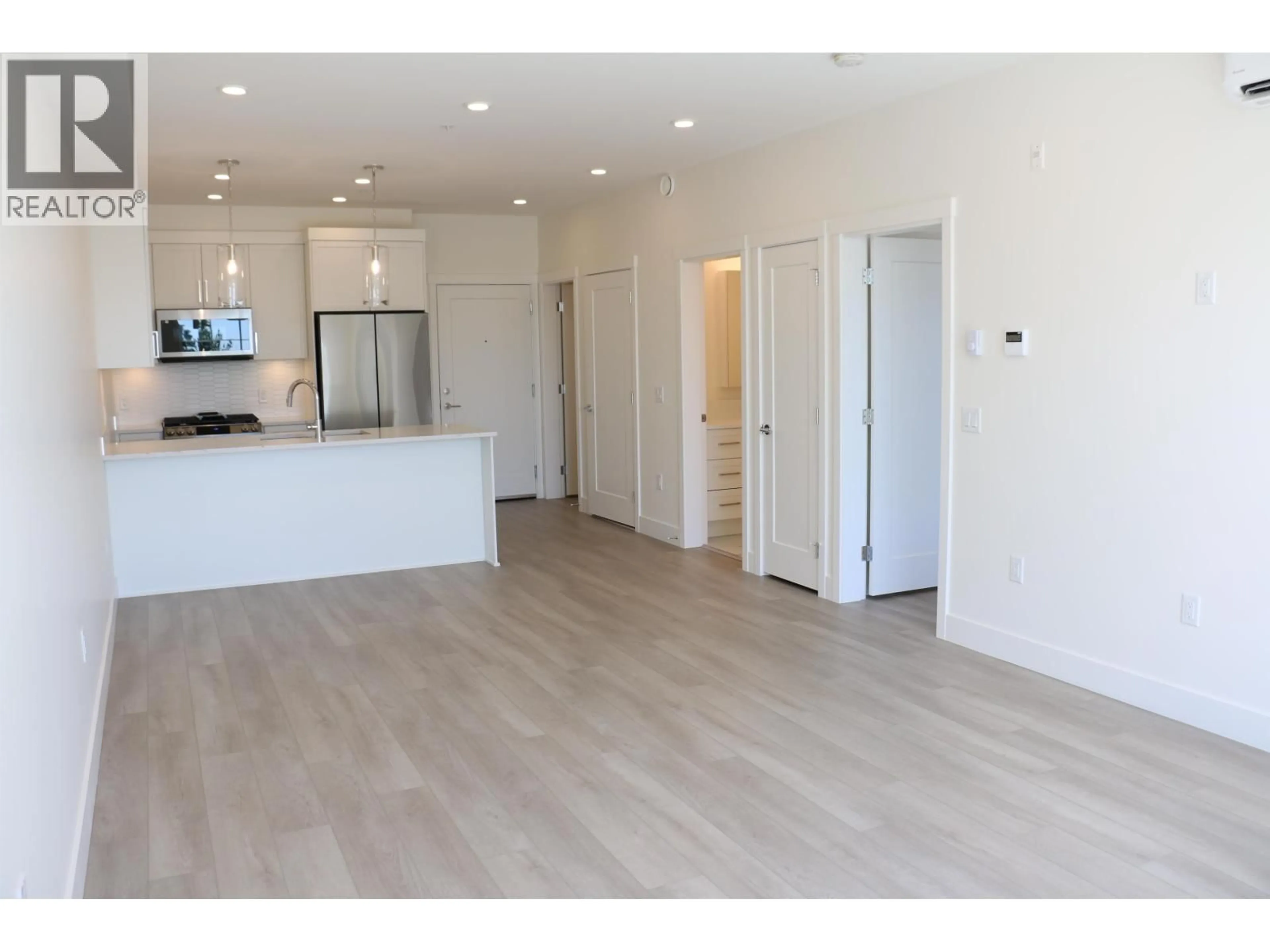 Open concept kitchen, wood/laminate floor for 308 - 22633 SELKIRK AVENUE, Maple Ridge British Columbia V2X1C7