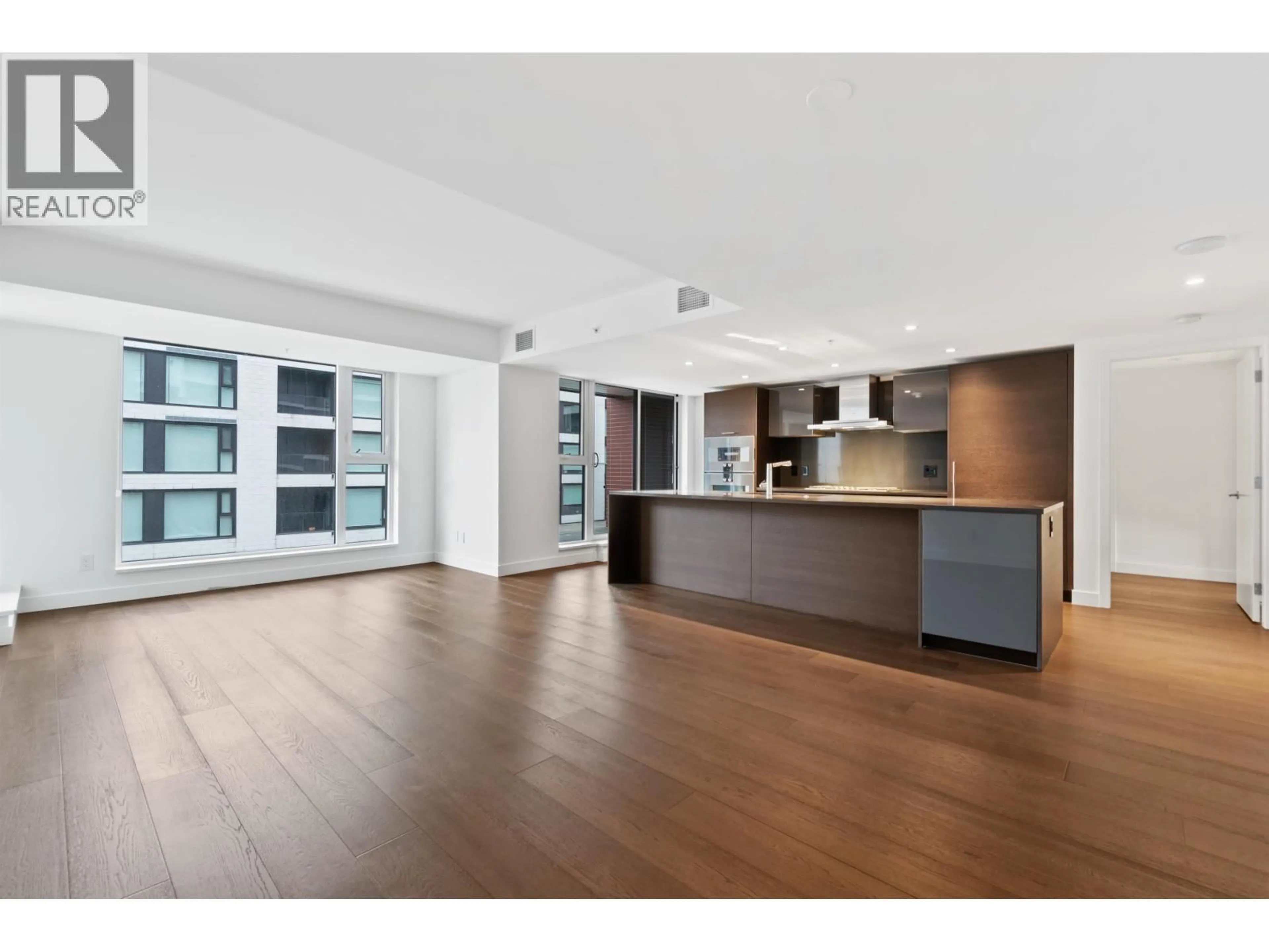 Open concept kitchen, wood/laminate floor for 603 - 1571 57TH AVENUE, Vancouver British Columbia V6P0H7