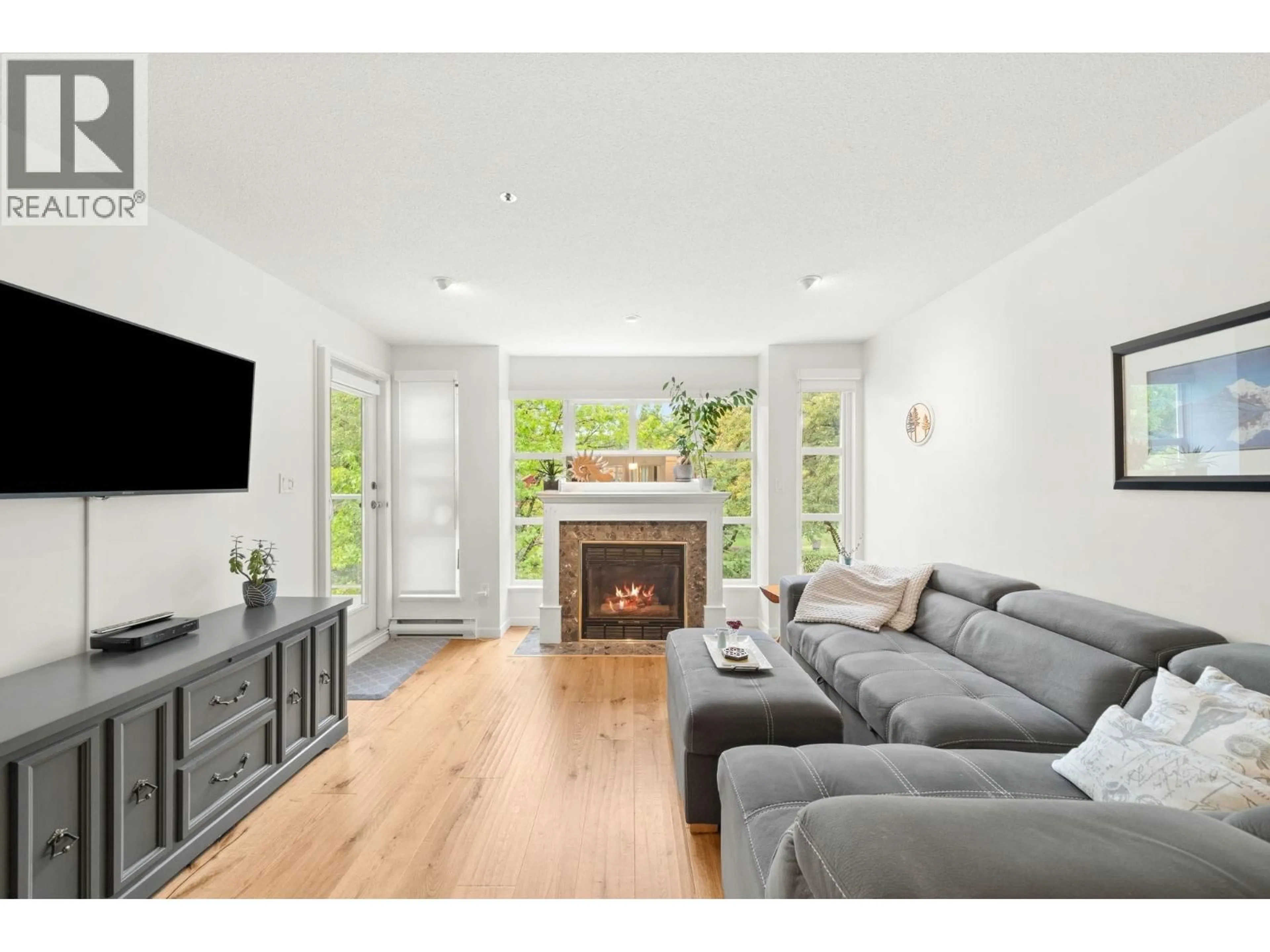 Living room with furniture, wood/laminate floor for 301 - 8728 SW MARINE DRIVE, Vancouver British Columbia V6P6A4