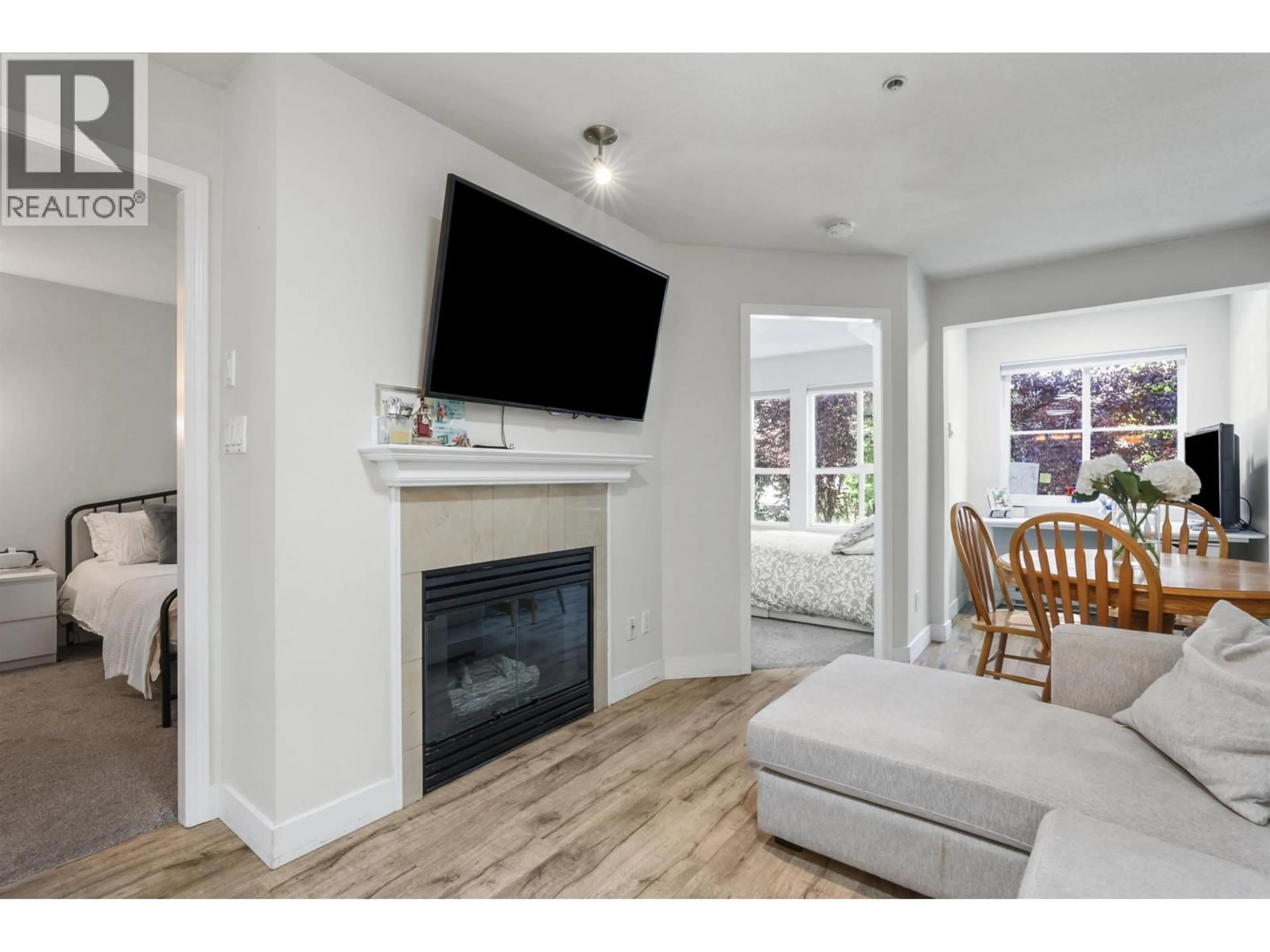Living room with furniture, wood/laminate floor for 203 - 3278 HEATHER STREET, Vancouver British Columbia V5Z4R9