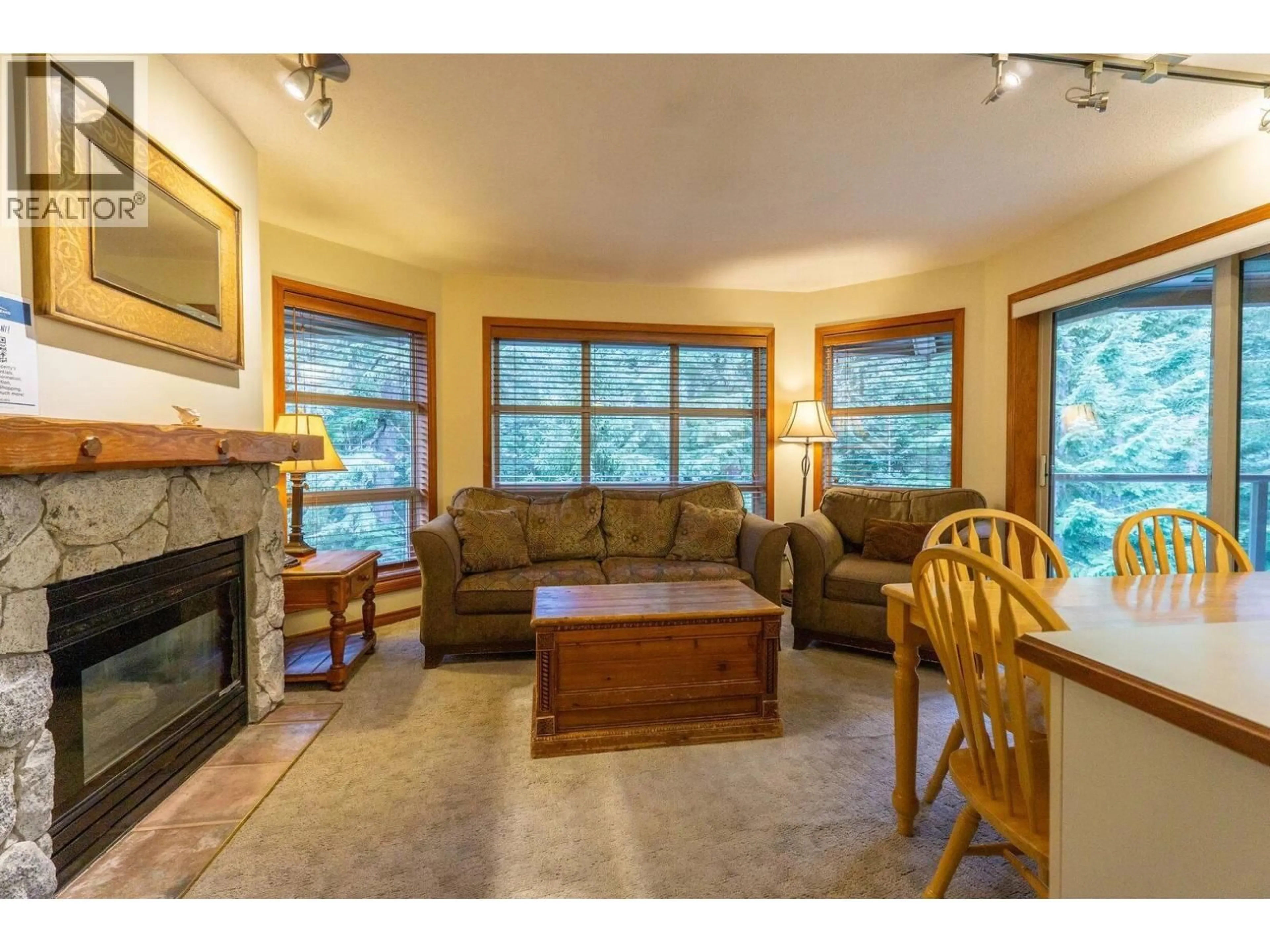 Living room with furniture, wood/laminate floor for 427 - 4800 SPEARHEAD DRIVE, Whistler British Columbia V8E1G1