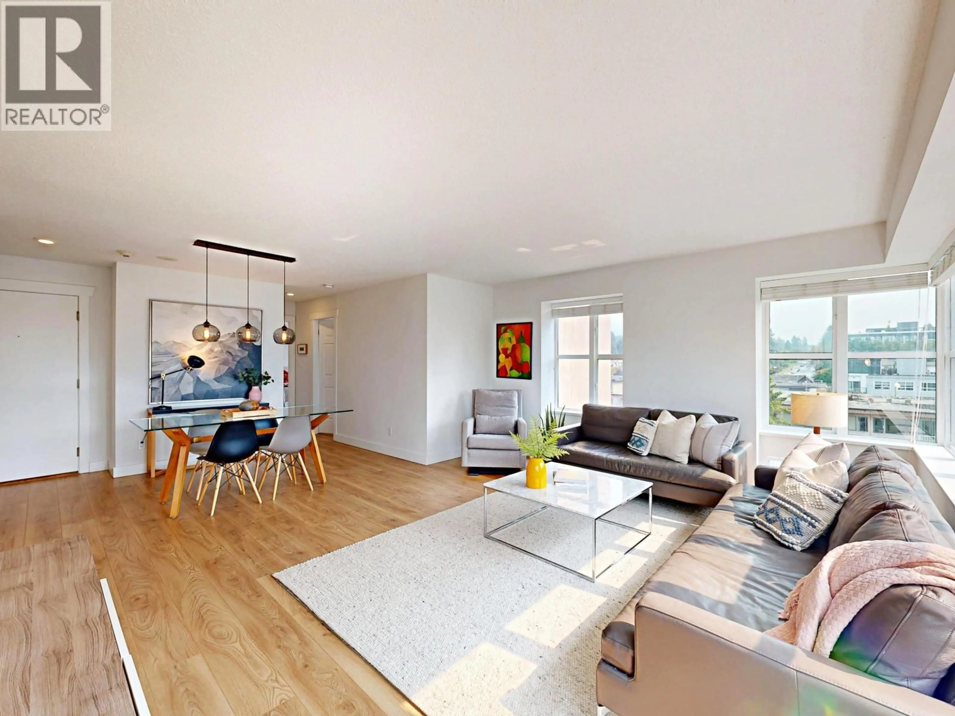 Living room with furniture, wood/laminate floor for 603 - 1555 EASTERN AVENUE, North Vancouver British Columbia V7L3G2