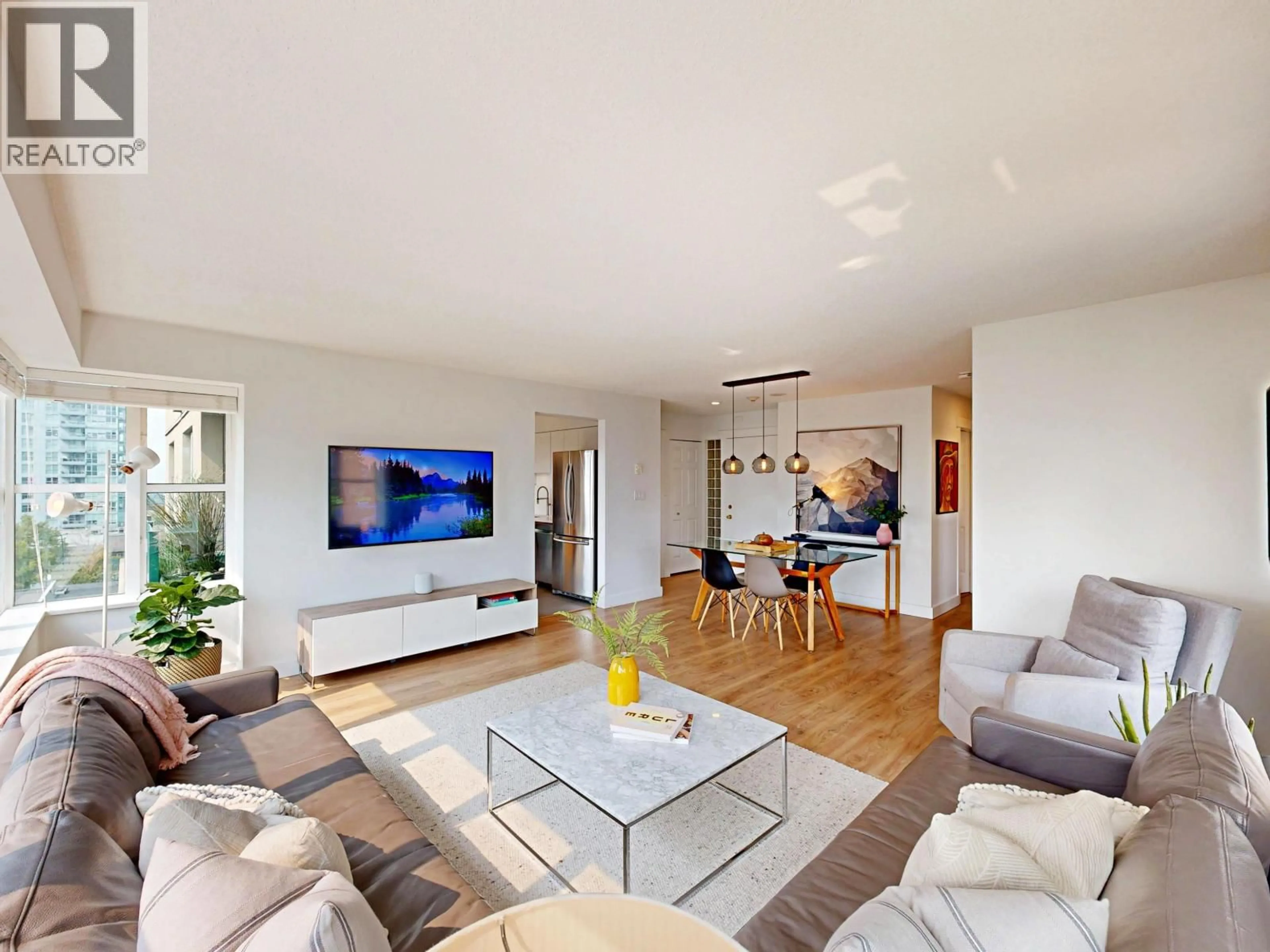 Living room with furniture, wood/laminate floor for 603 - 1555 EASTERN AVENUE, North Vancouver British Columbia V7L3G2