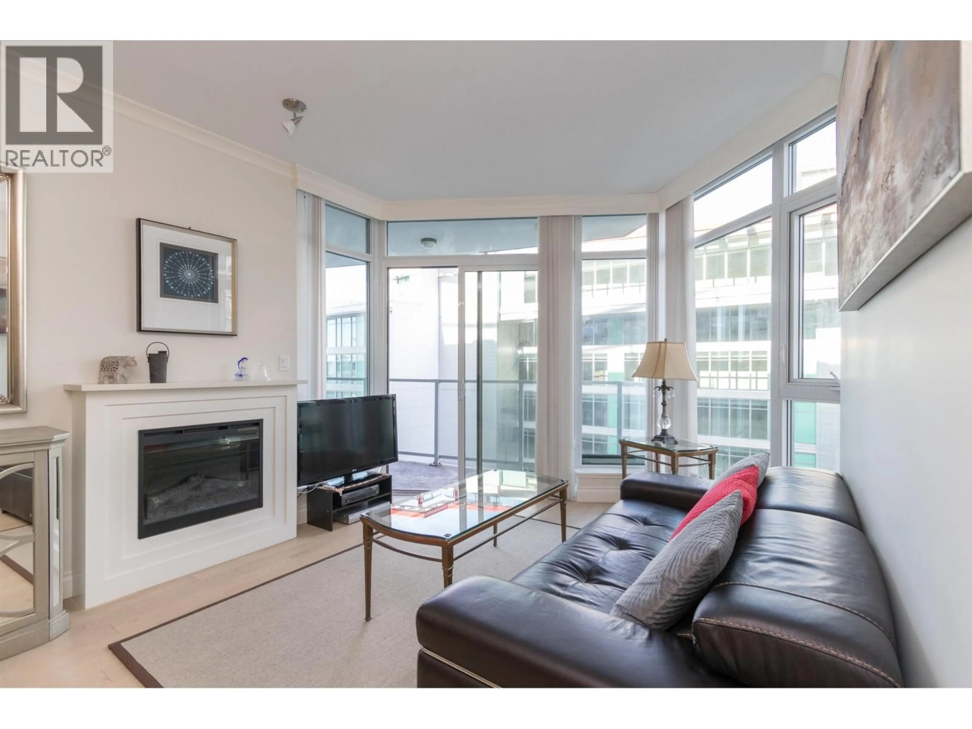 Living room with furniture, unknown for 705 - 199 VICTORY SHIP WAY, North Vancouver British Columbia V7N0E2