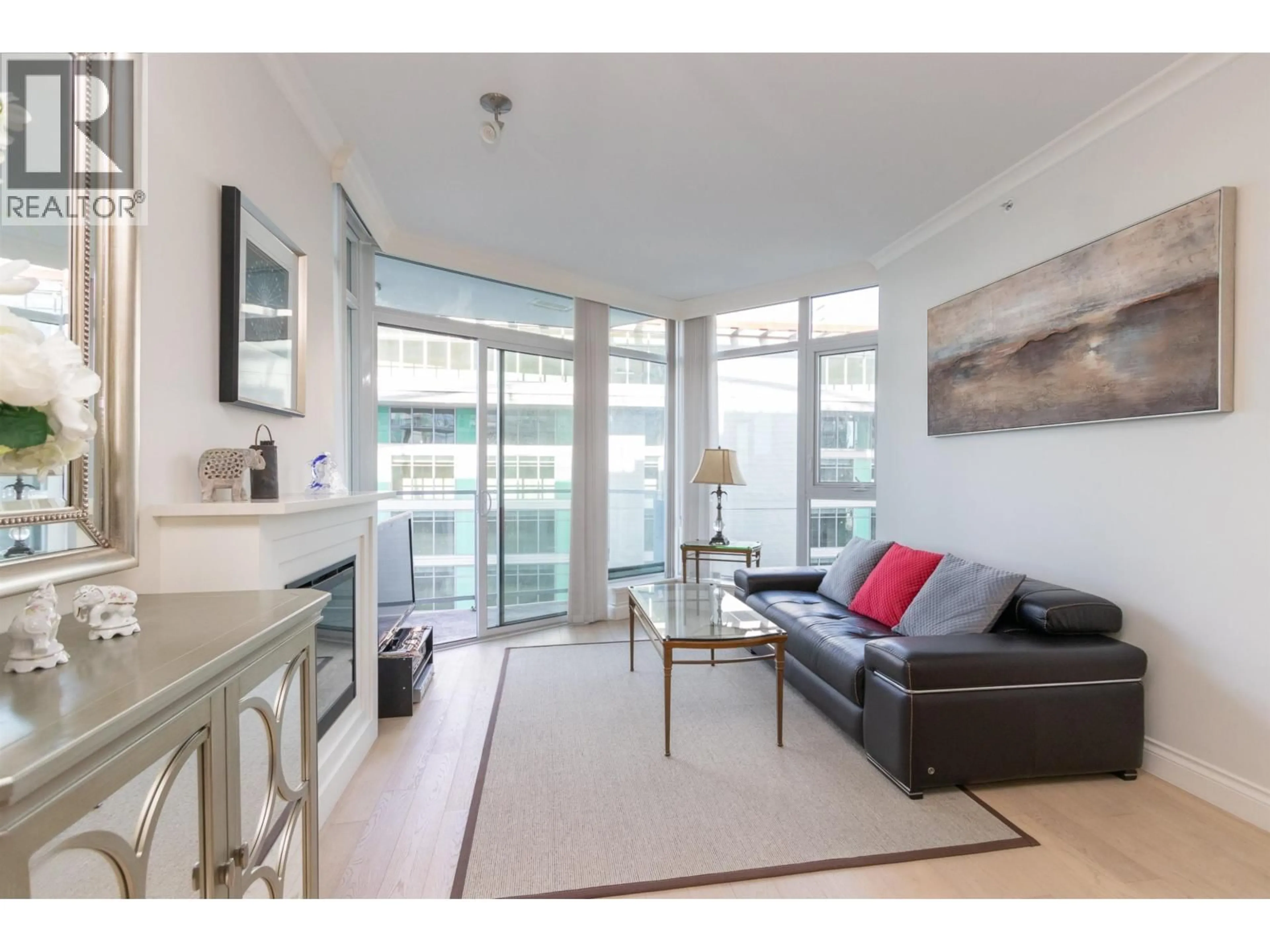 Living room with furniture, unknown for 705 - 199 VICTORY SHIP WAY, North Vancouver British Columbia V7N0E2