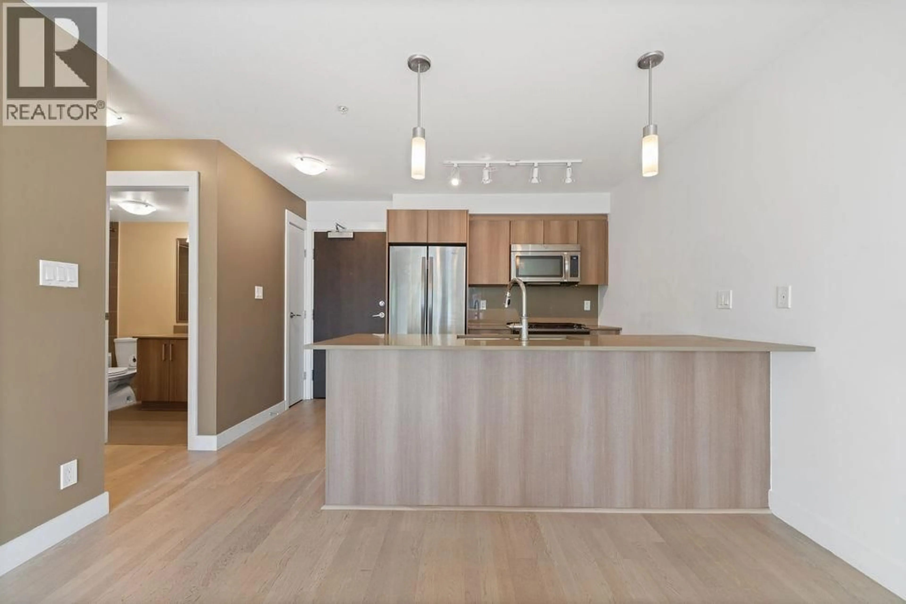 Open concept kitchen, wood/laminate floor for 325 - 7058 14TH AVENUE, Burnaby British Columbia V3N0E6