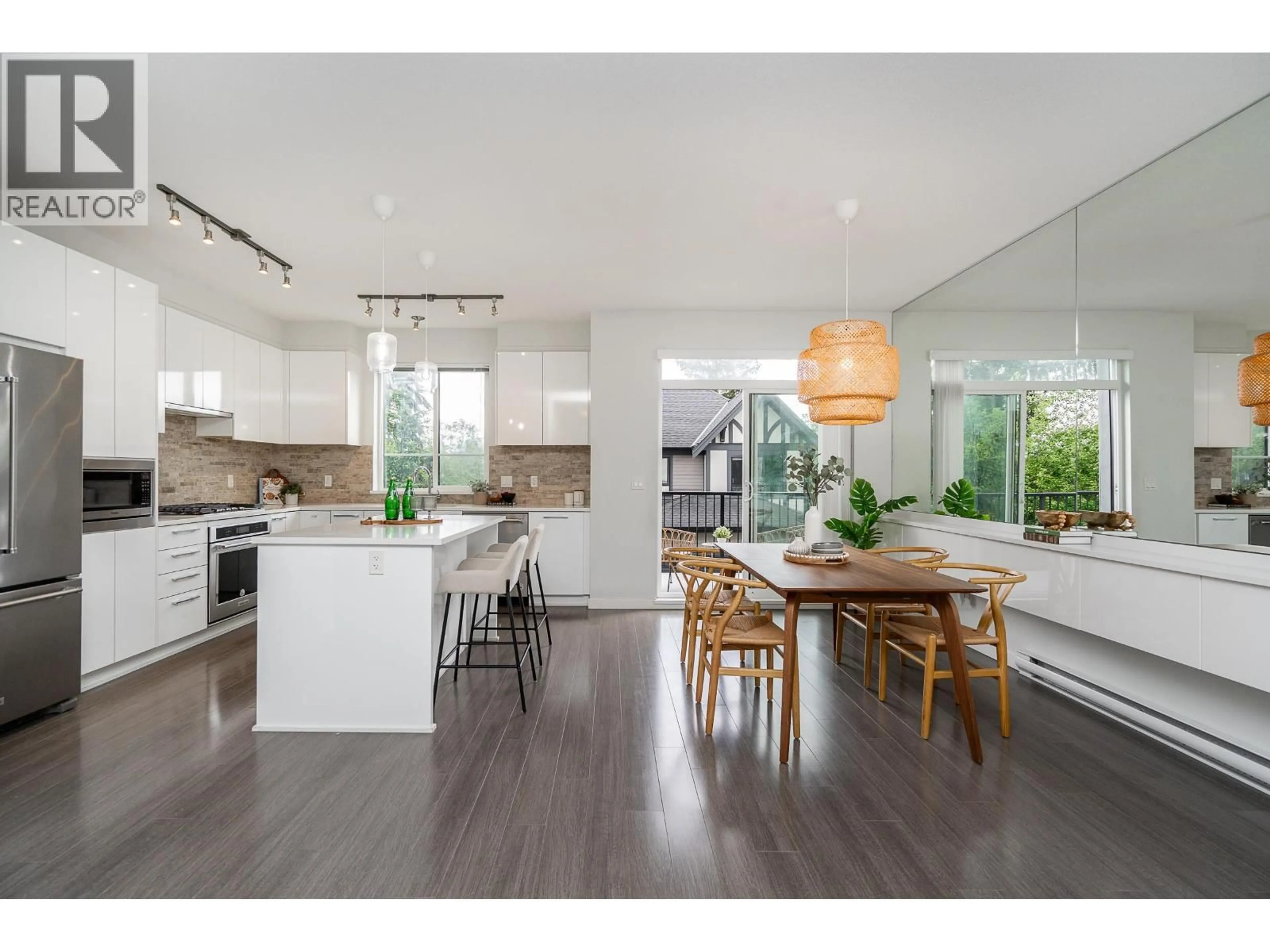 Open concept kitchen, wood/laminate floor for 140 - 3500 BURKE VILLAGE PROMENADE, Coquitlam British Columbia V3E0N2