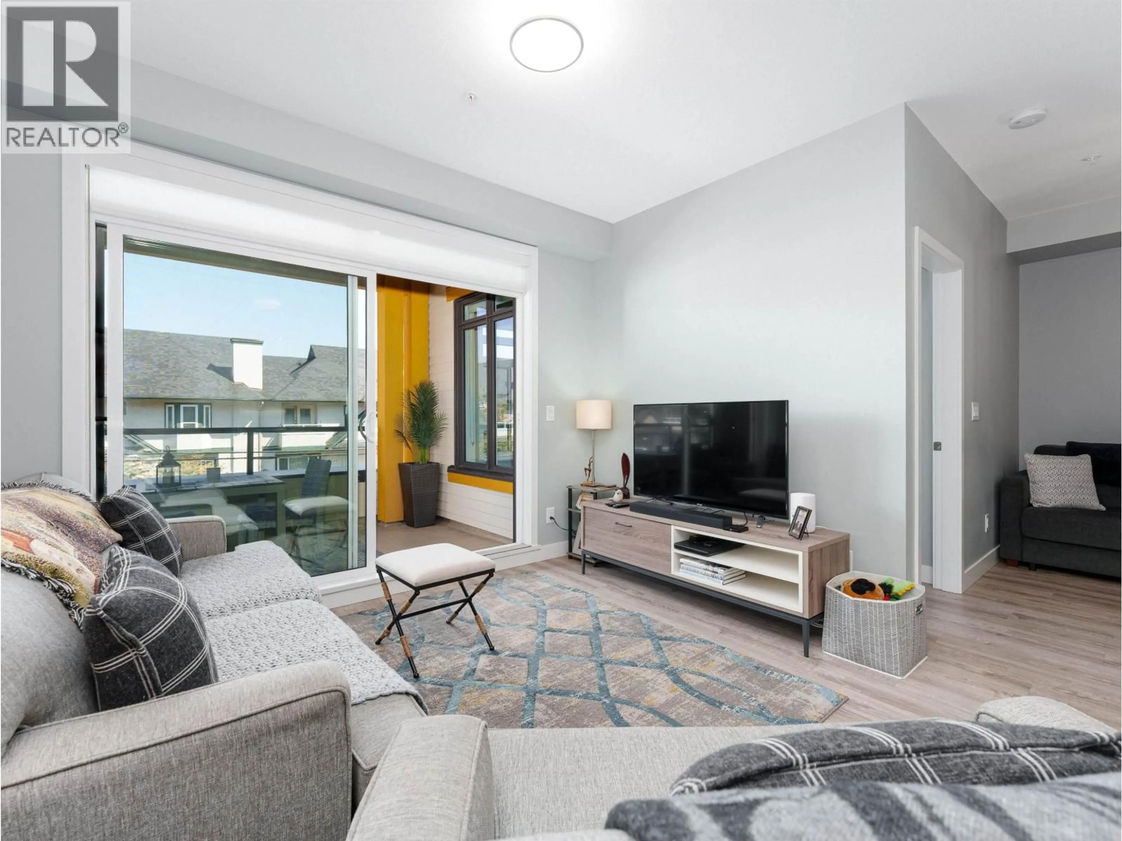 Living room with furniture, unknown for 301 - 3971 HASTINGS STREET, Burnaby British Columbia V5C2H8