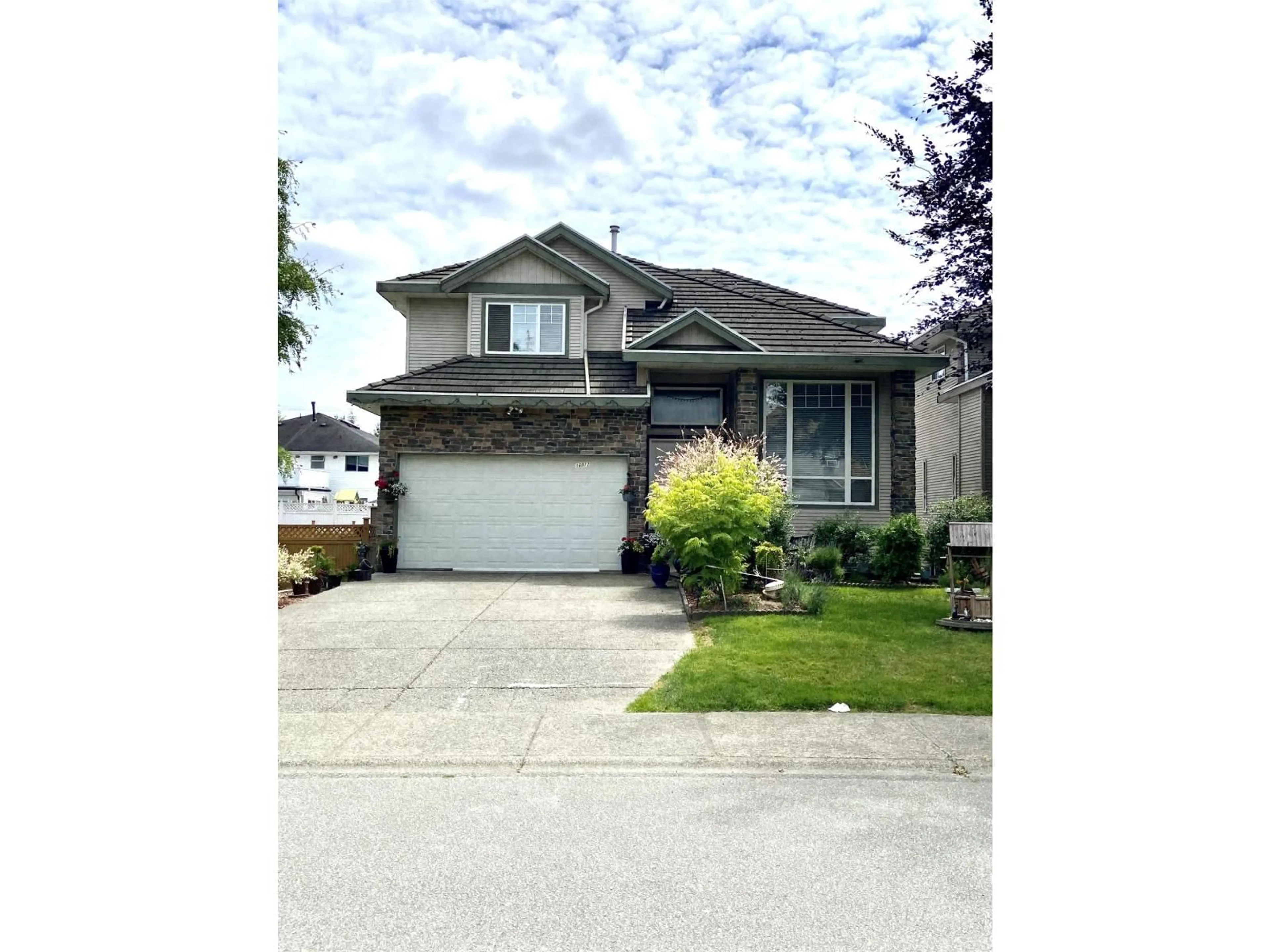 Home with vinyl exterior material, street for 16072 96A, Surrey British Columbia V4N3K8