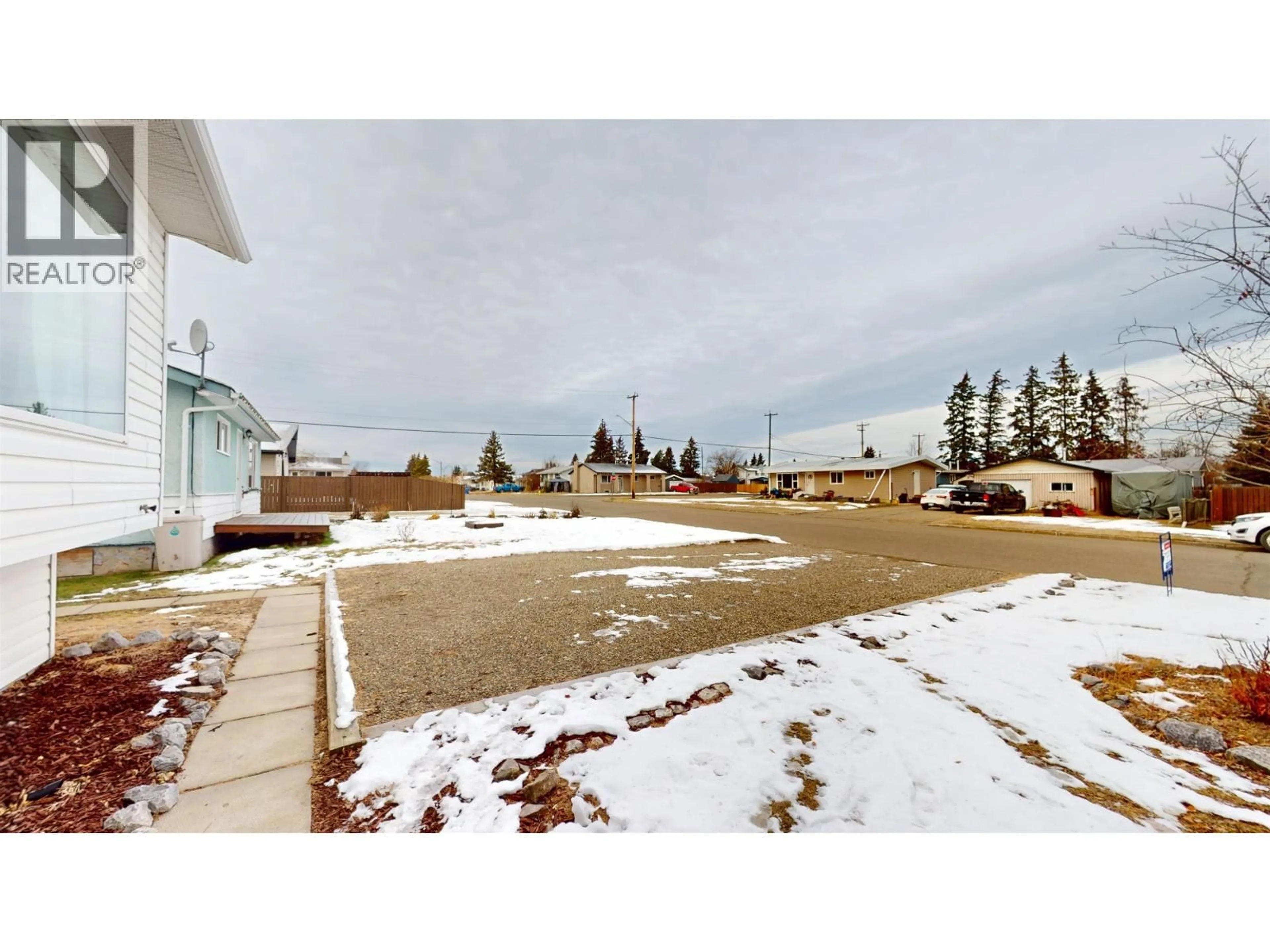 A pic from outside/outdoor area/front of a property/back of a property/a pic from drone, mountain view for 9115 105 AVENUE, Fort St. John British Columbia V1J2L5
