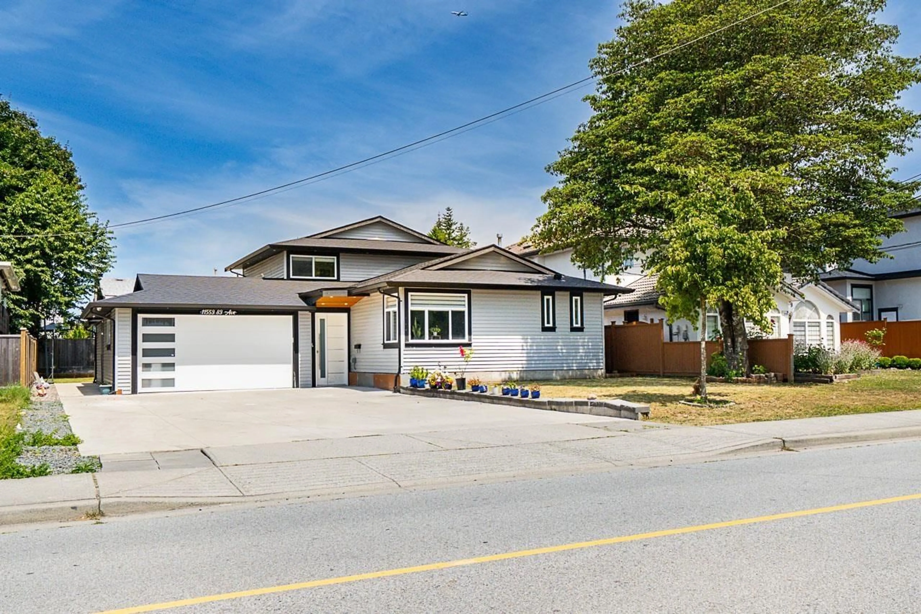 Home with vinyl exterior material, street for 11553 83, Surrey British Columbia V4C2G9
