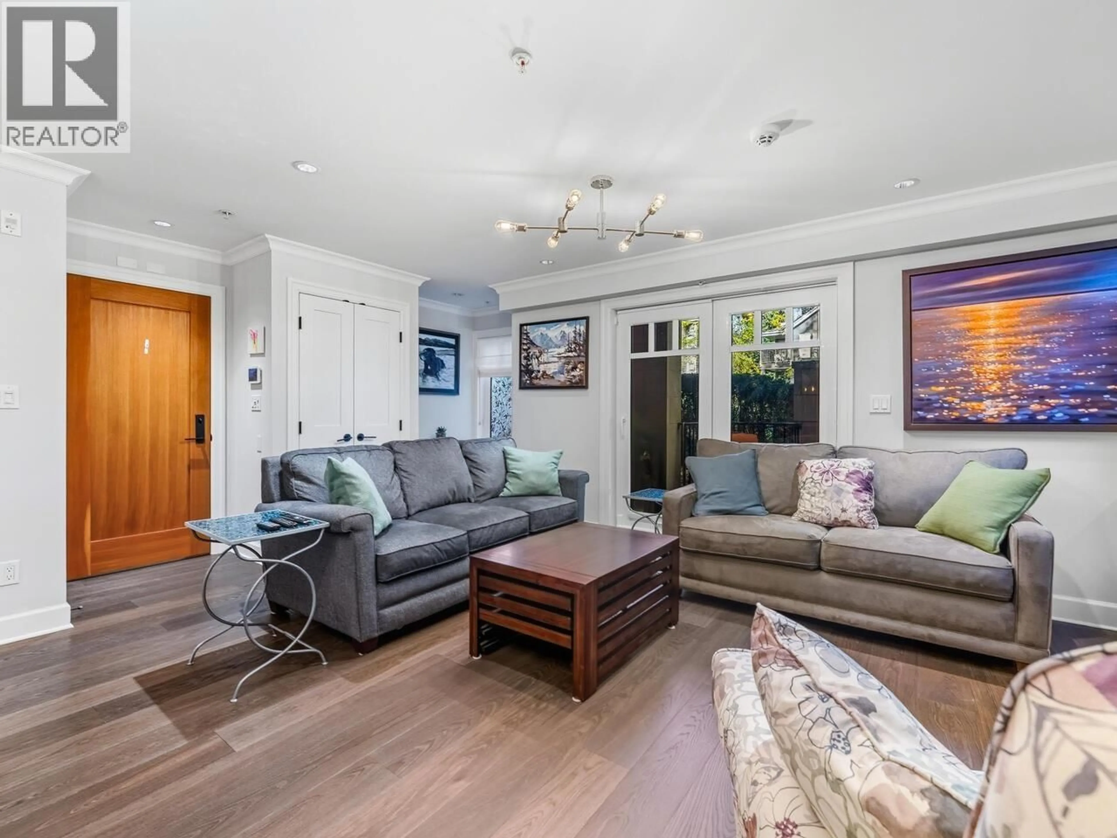 Living room with furniture, wood/laminate floor for 100 - 656 13TH AVENUE, Vancouver British Columbia V5Z1N9