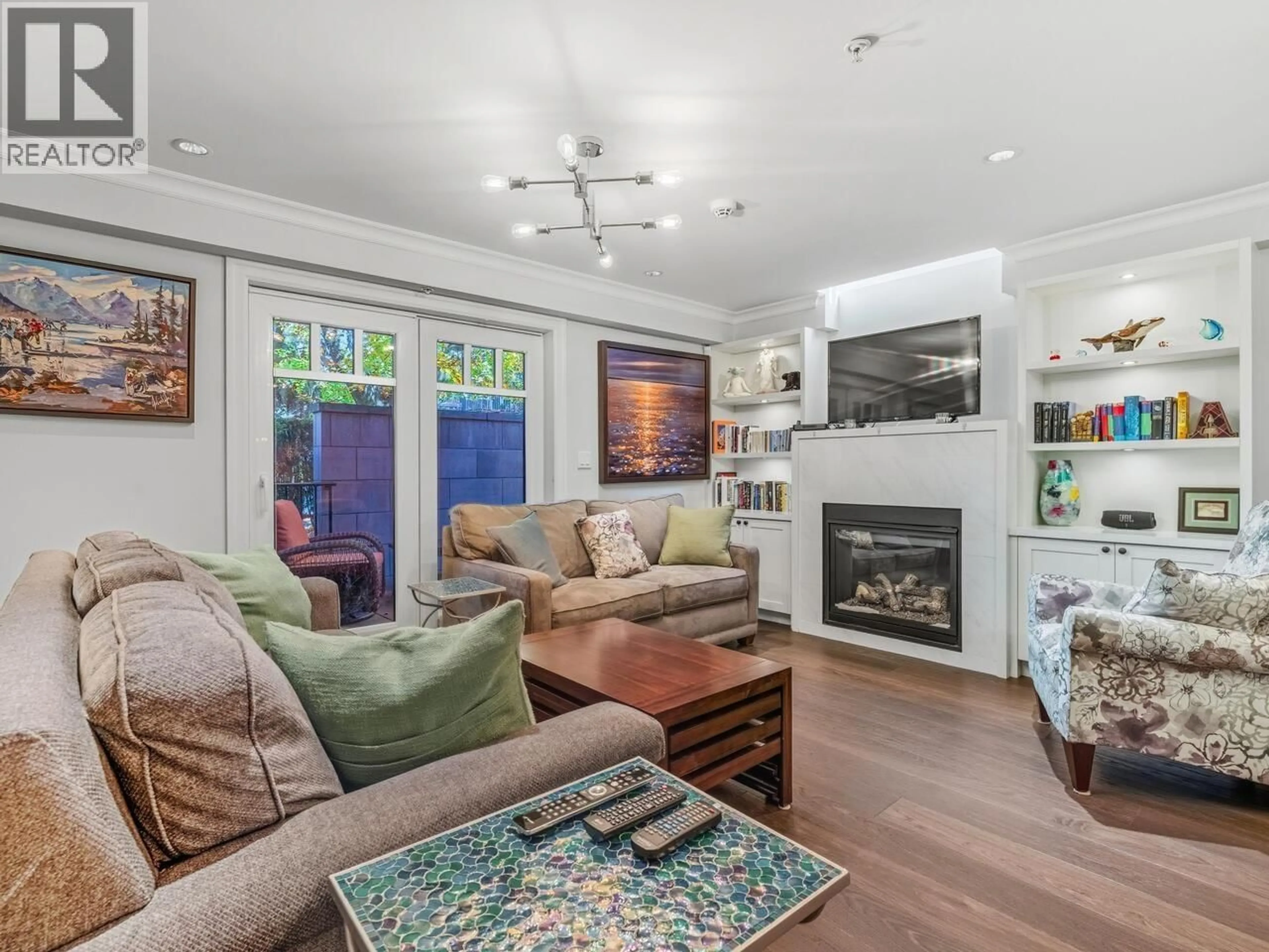 Living room with furniture, wood/laminate floor for 100 - 656 13TH AVENUE, Vancouver British Columbia V5Z1N9