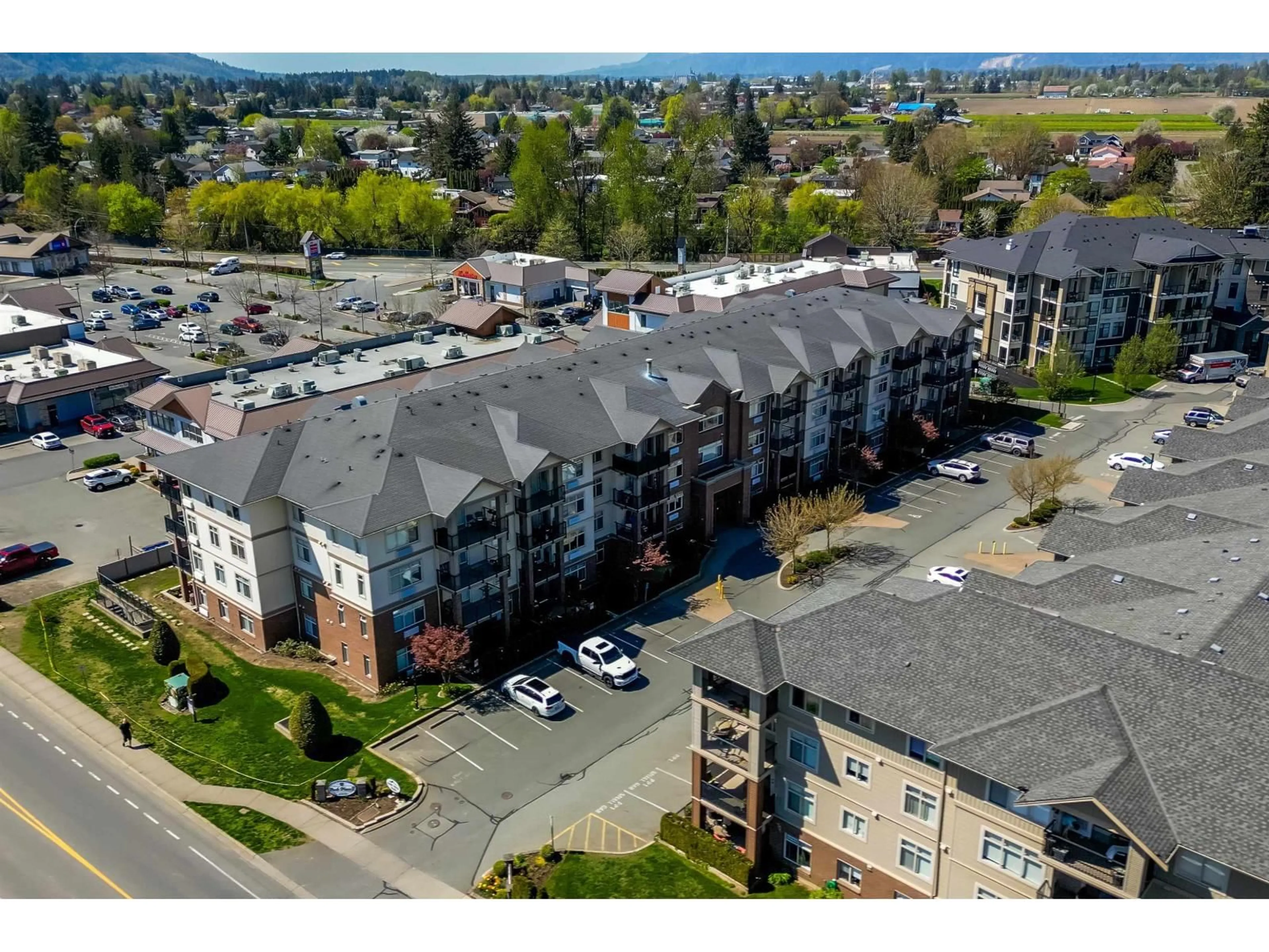 A pic from outside/outdoor area/front of a property/back of a property/a pic from drone, mountain view for 318 - 45769 STEVENSON ROAD, Chilliwack British Columbia V2R5Z2