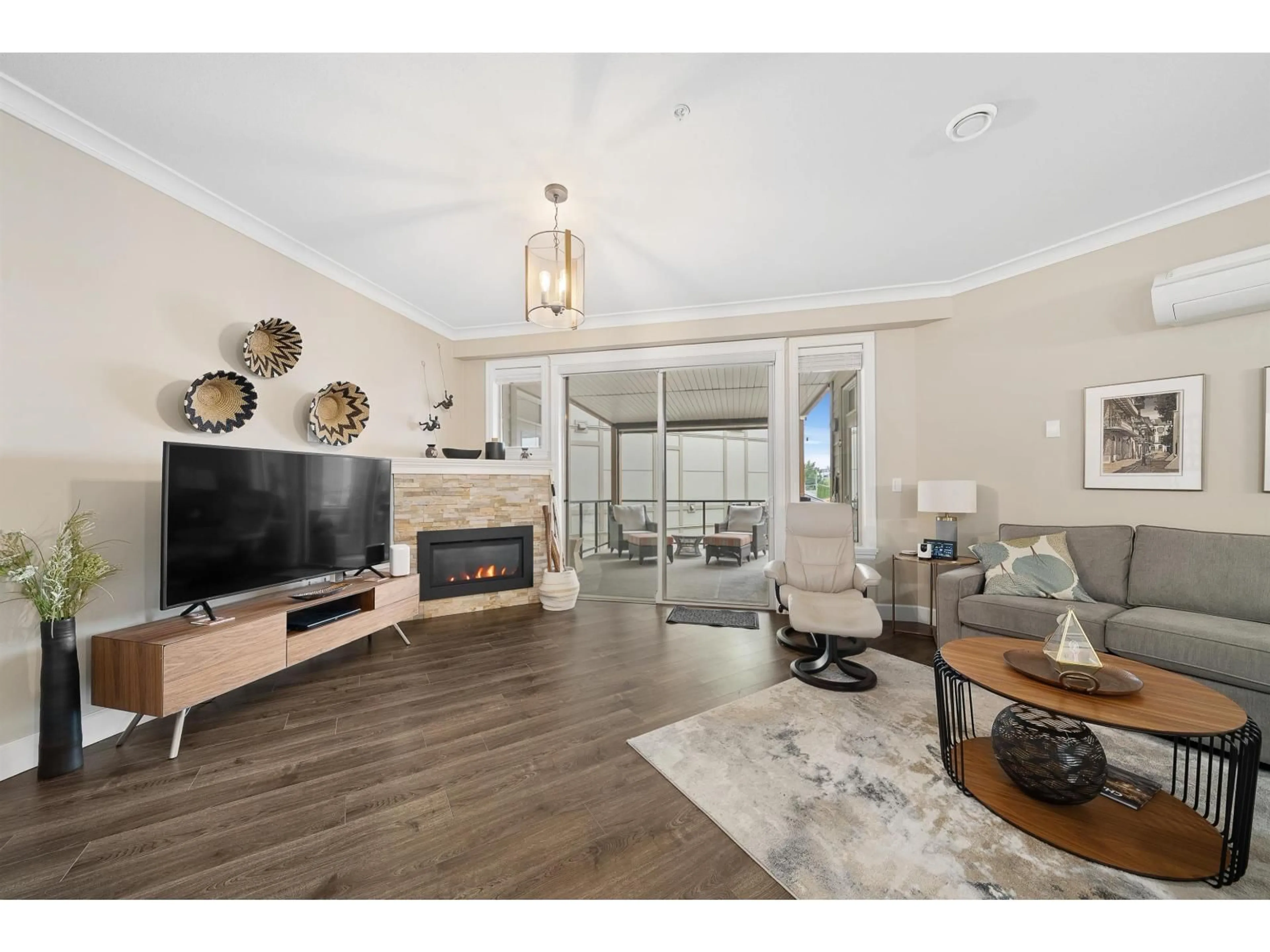 Living room with furniture, wood/laminate floor for 301 - 45746 KEITH WILSON ROAD, Chilliwack British Columbia V2R0X3