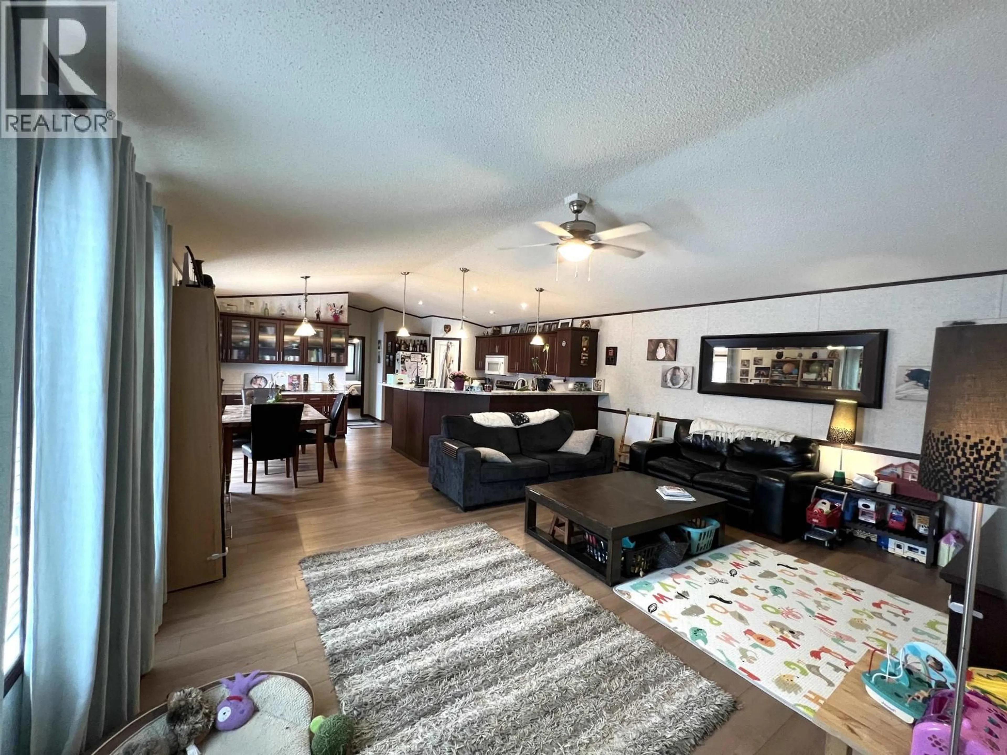 Living room with furniture, unknown for 5506 PINE CRESCENT, Fort Nelson British Columbia V0C1R0