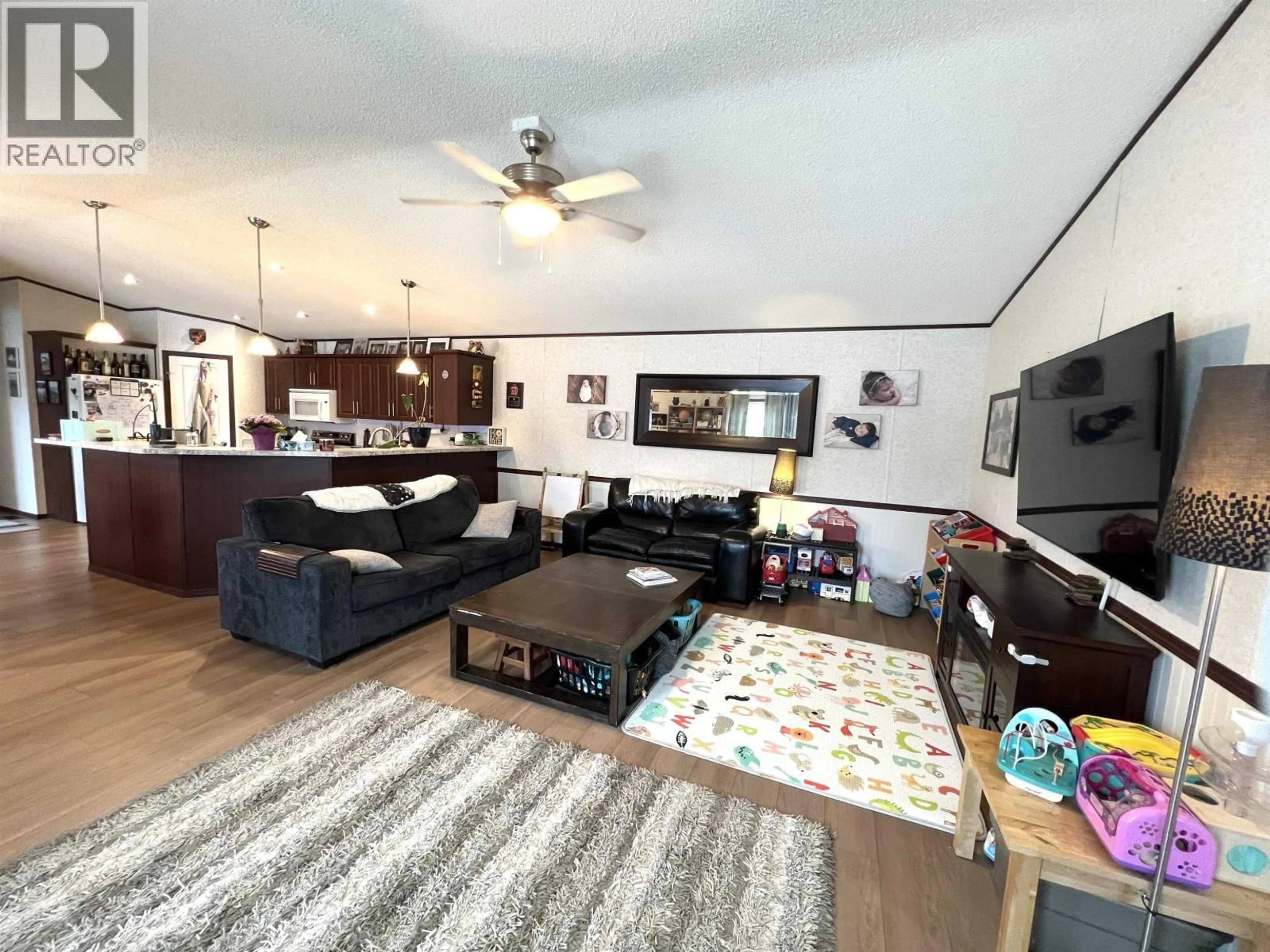 Living room with furniture, unknown for 5506 PINE CRESCENT, Fort Nelson British Columbia V0C1R0