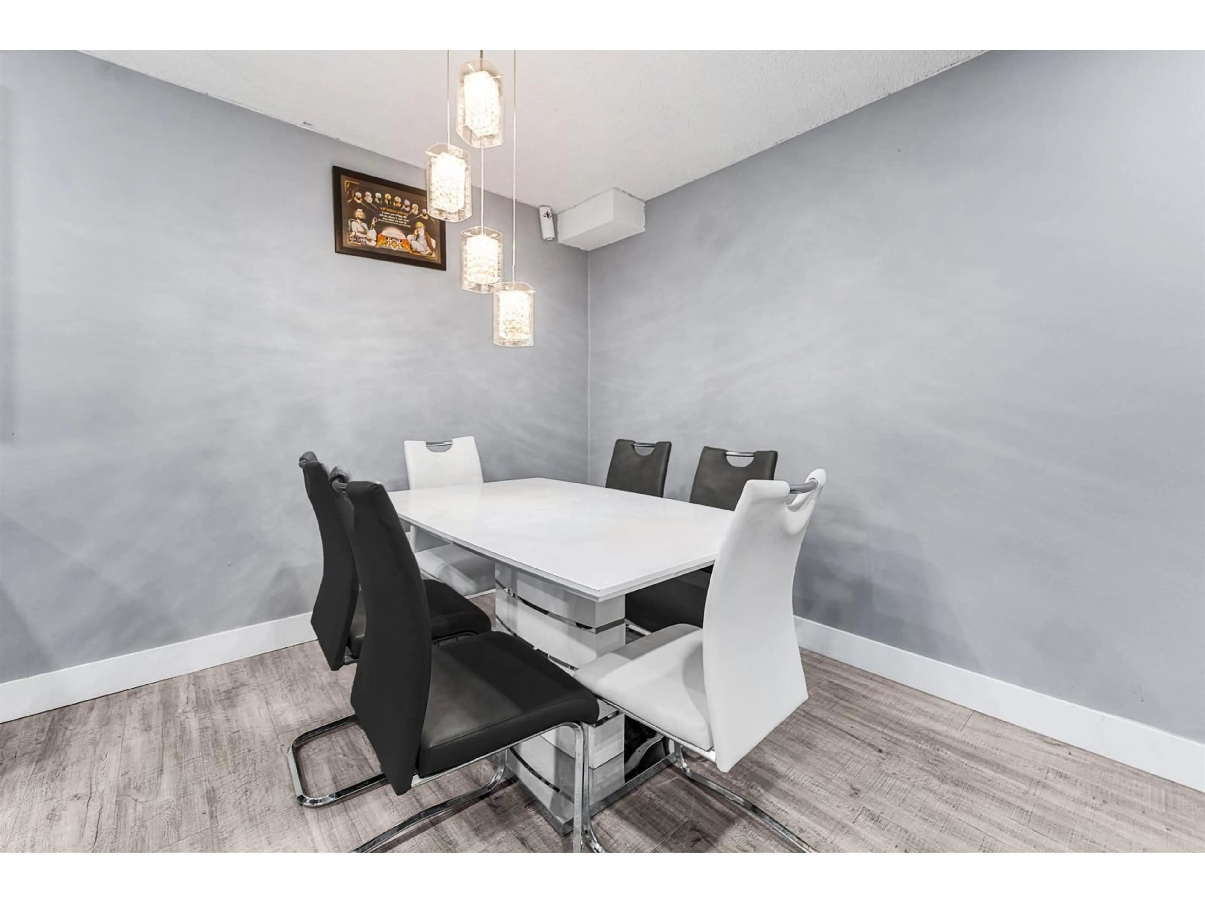 Dining room, wood/laminate floor for 312 - 10061 150, Surrey British Columbia V3R4A7