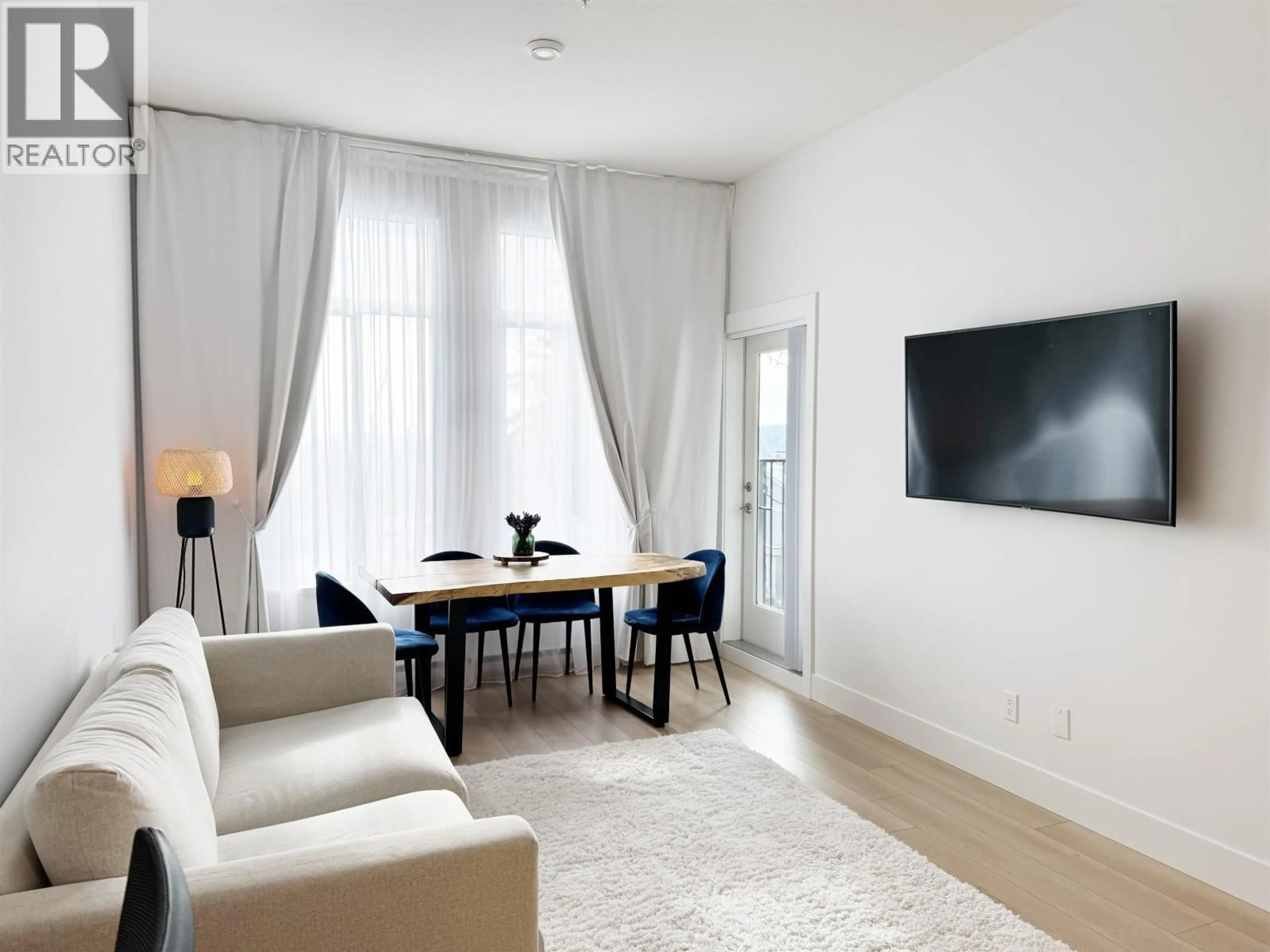 Living room with furniture, wood/laminate floor for 209 - 708 EDGAR AVENUE, Coquitlam British Columbia V3K0H3