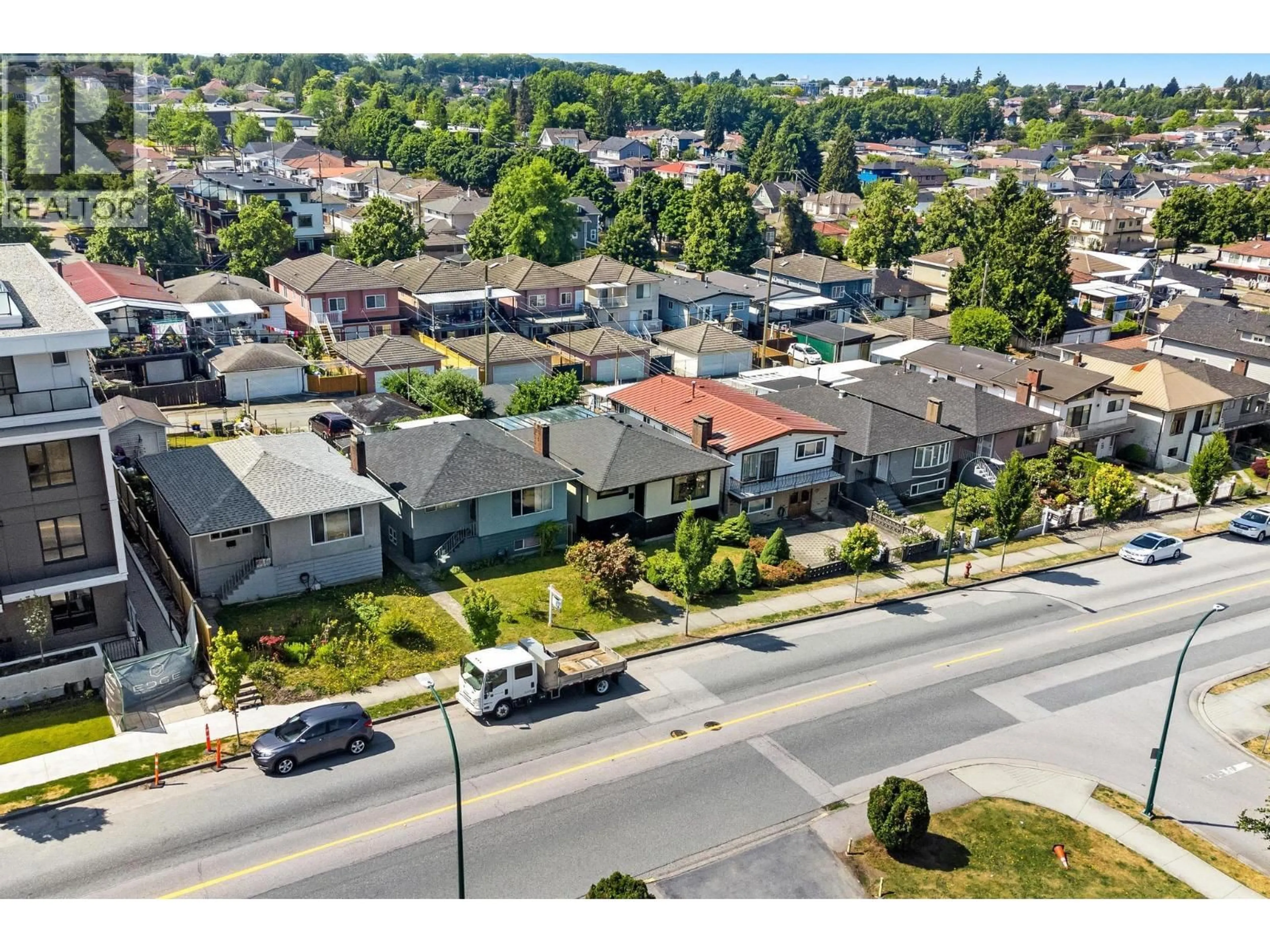 A pic from outside/outdoor area/front of a property/back of a property/a pic from drone, street for 2366 33RD AVENUE, Vancouver British Columbia V5R2S3