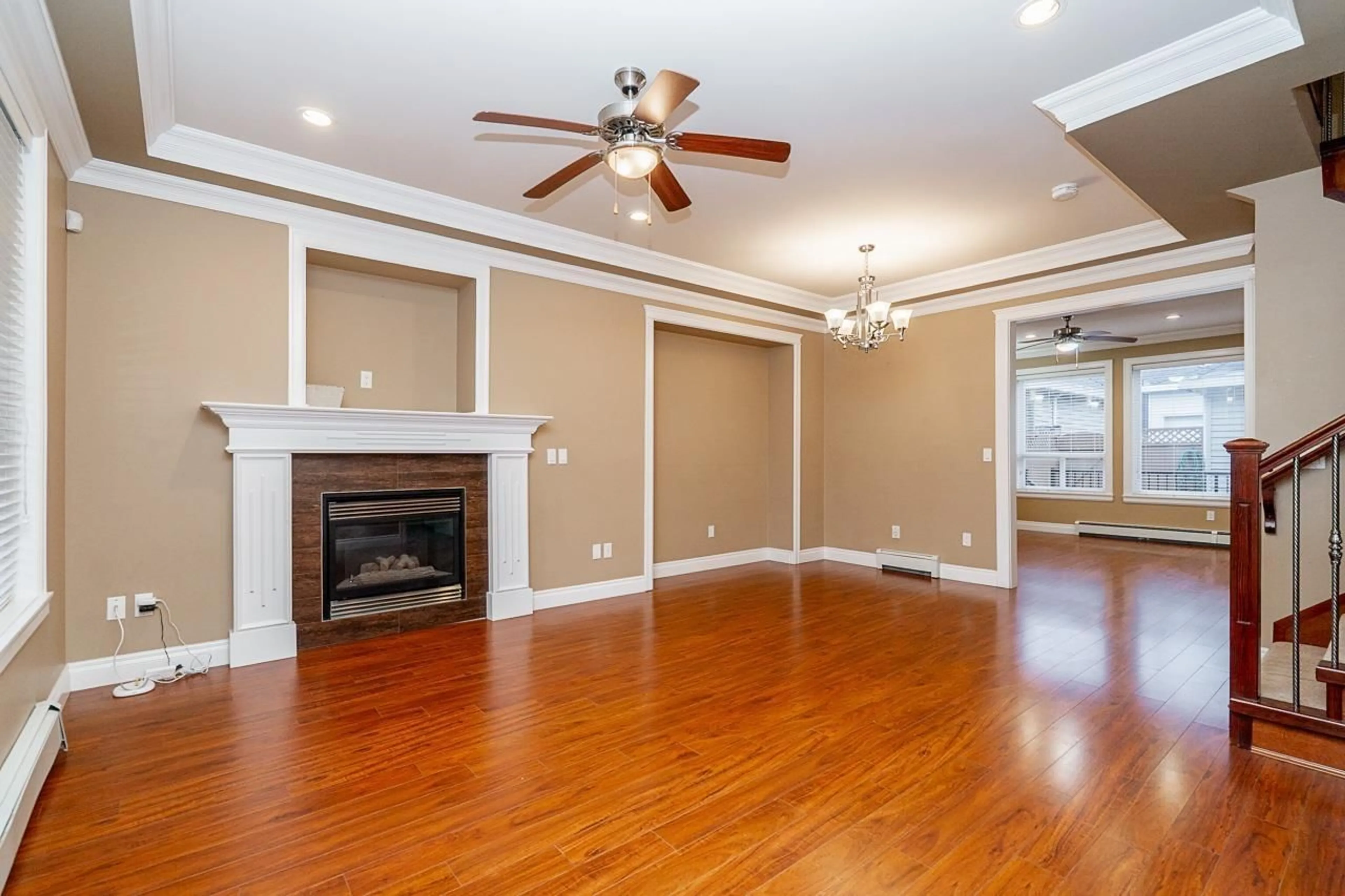 Living room with furniture, wood/laminate floor for 5962 129, Surrey British Columbia V3X0C7