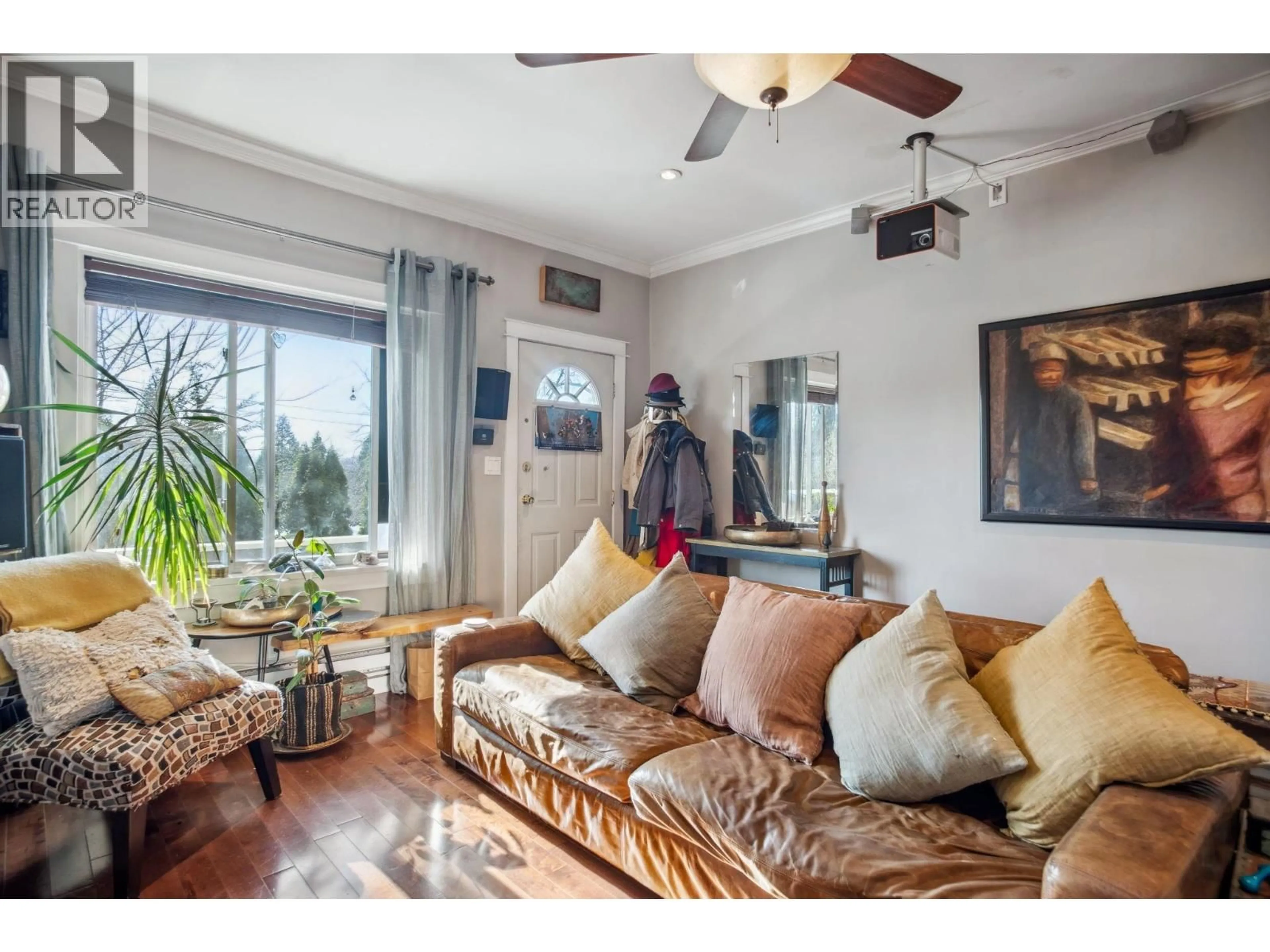 Living room with furniture, wood/laminate floor for 3617 ADANAC STREET, Vancouver British Columbia V5K2P7