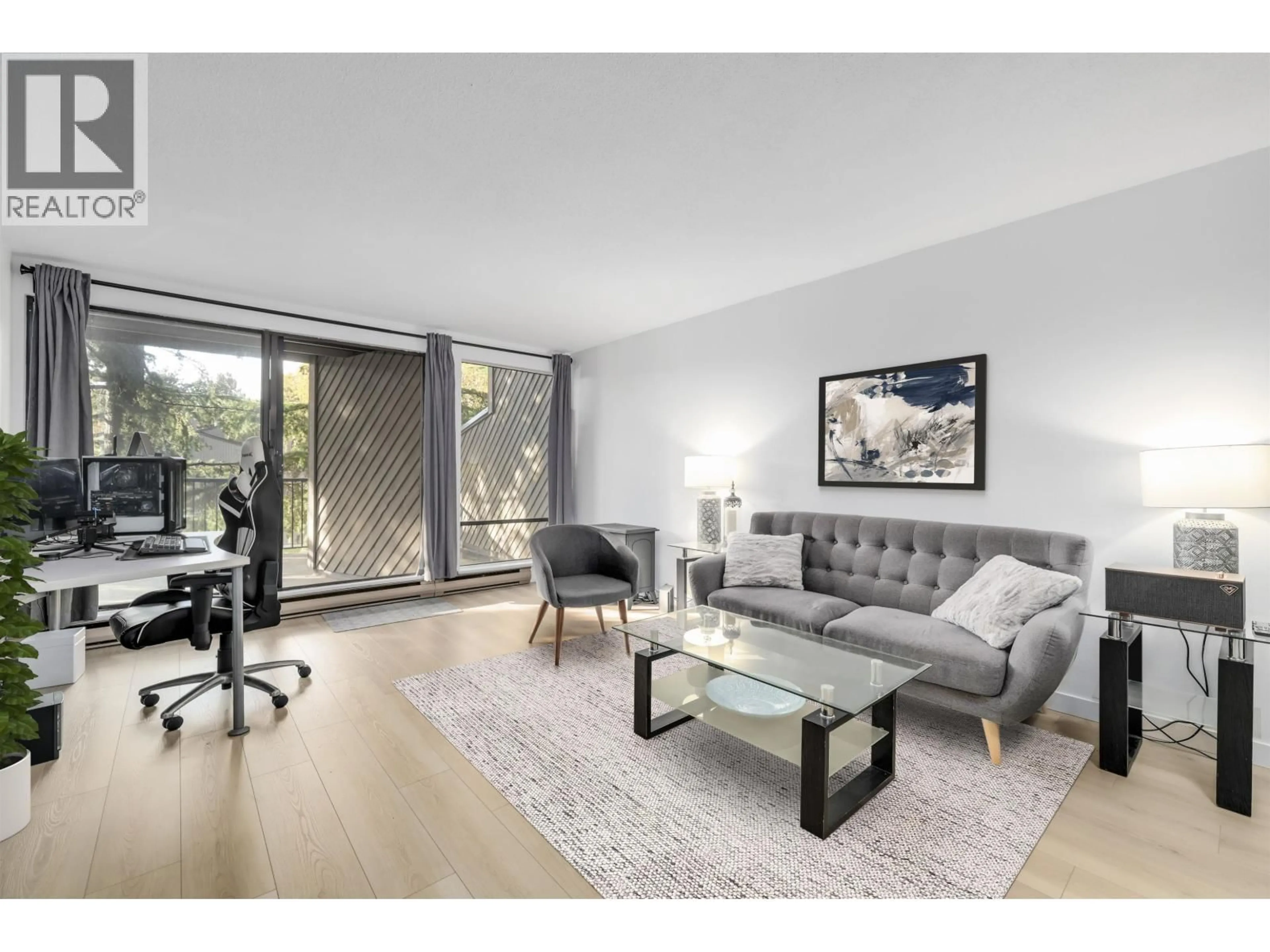 Living room with furniture, wood/laminate floor for 106 - 9300 GLENACRES DRIVE, Richmond British Columbia V7A1Y8