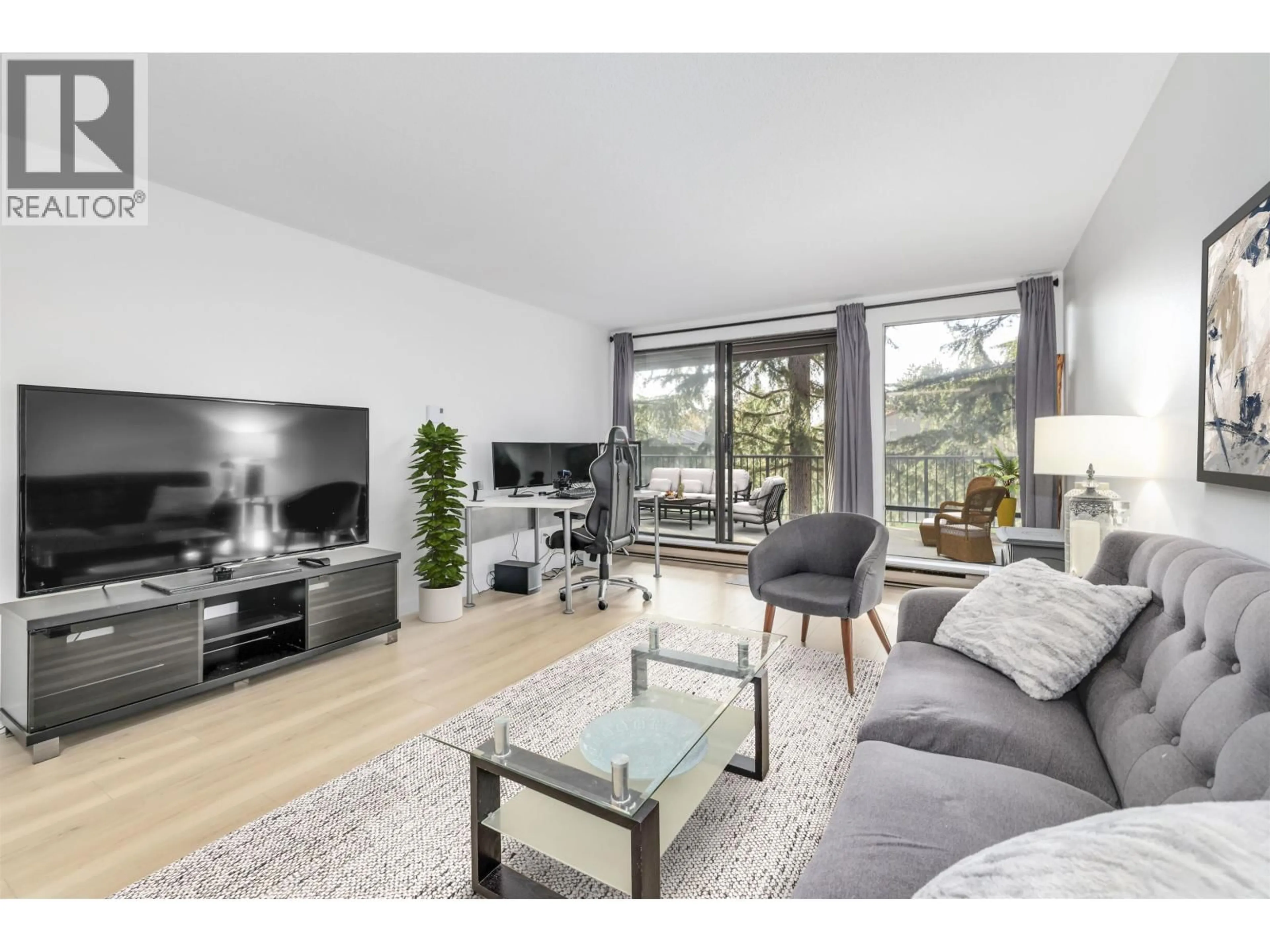 Living room with furniture, wood/laminate floor for 106 - 9300 GLENACRES DRIVE, Richmond British Columbia V7A1Y8