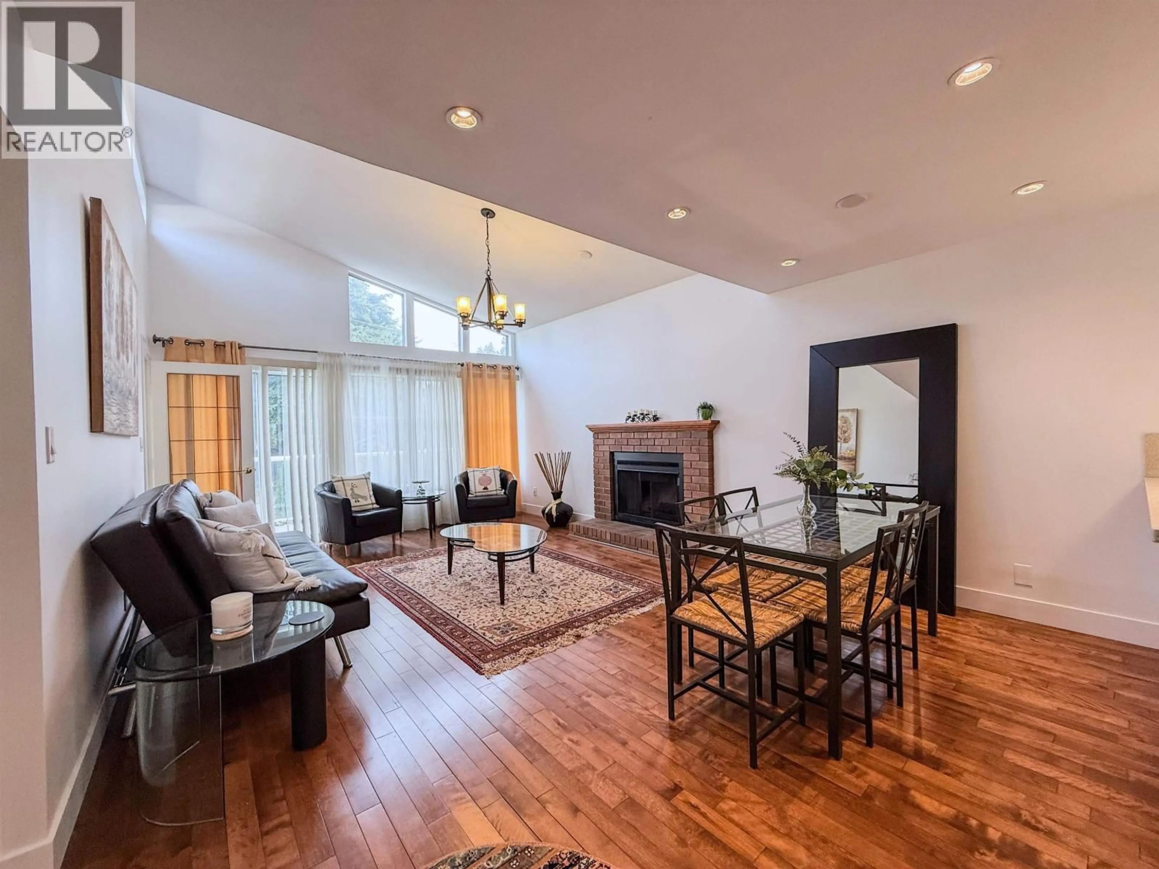 Living room with furniture, wood/laminate floor for 1717 TATLOW AVENUE, North Vancouver British Columbia V7P3A1