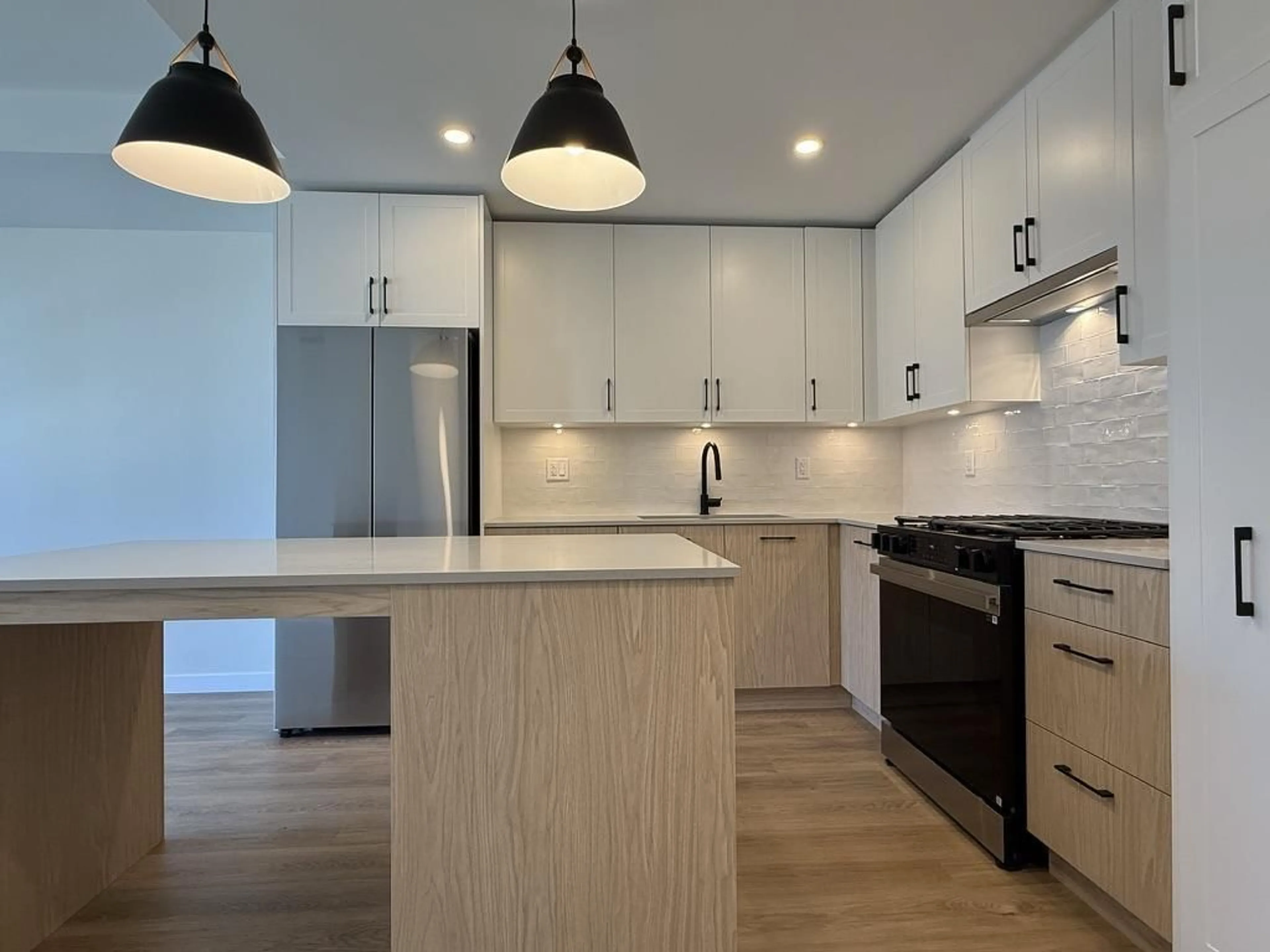 Open concept kitchen, wood/laminate floor for 204 - 27218 ALDERGROVE TOWN CENTRE, Langley British Columbia V4W0E4