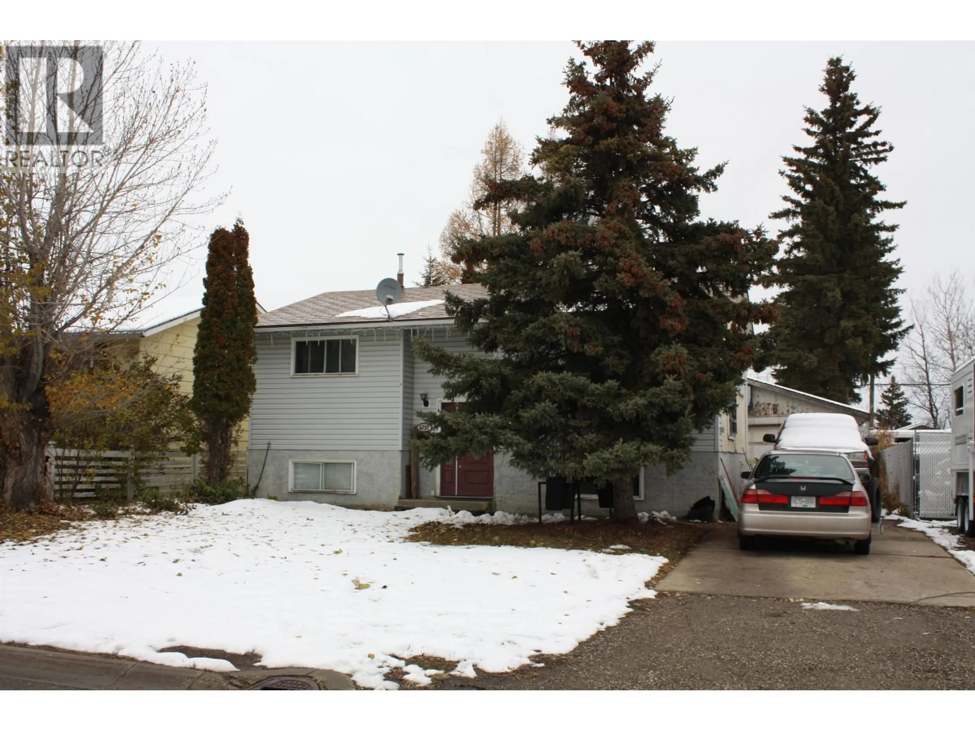 Home with vinyl exterior material, street for 8232 98 AVENUE, Fort St. John British Columbia V1J1P5