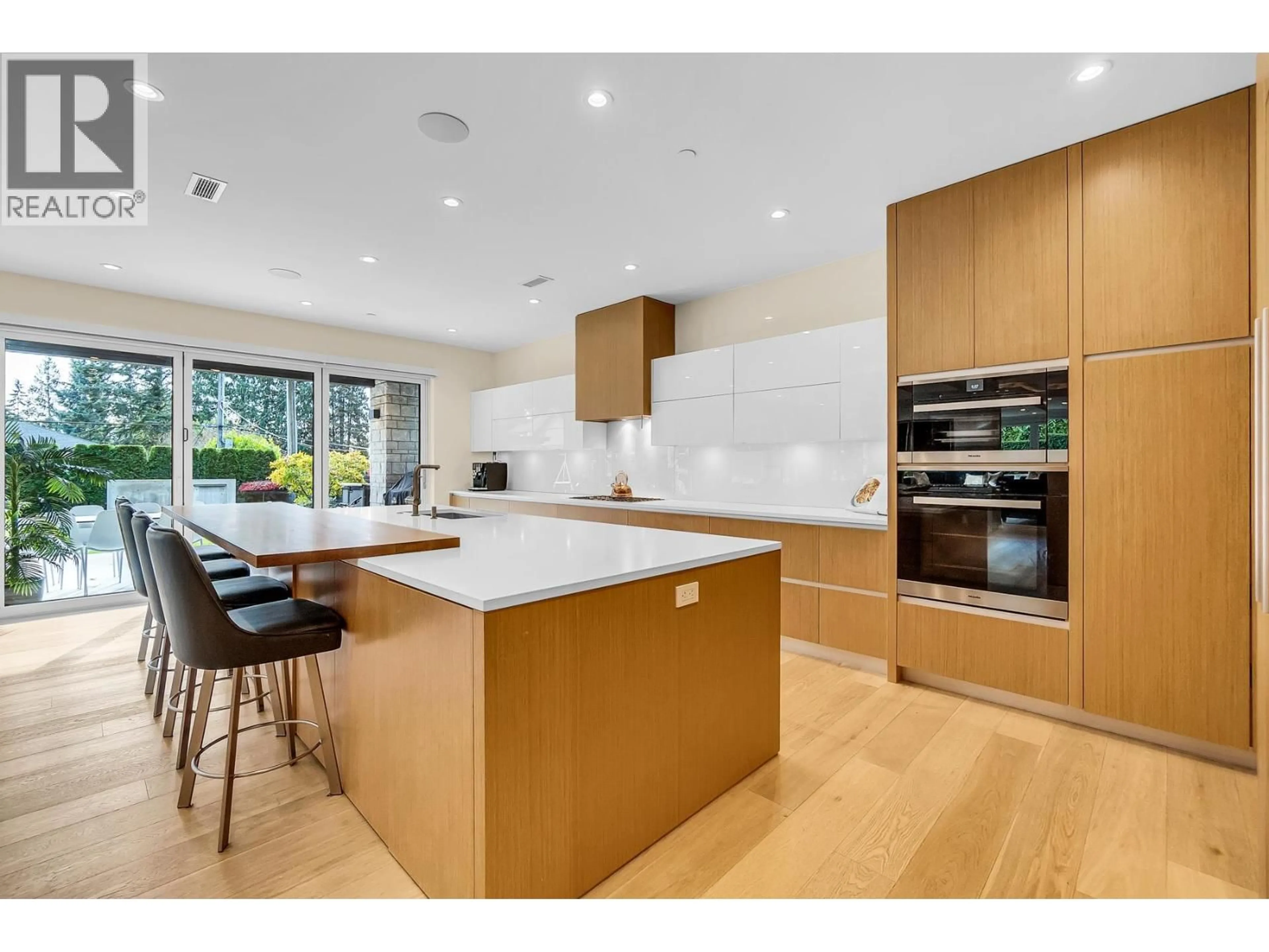 Contemporary kitchen, wood/laminate floor for 5141 SARITA AVENUE, North Vancouver British Columbia V7R2M4