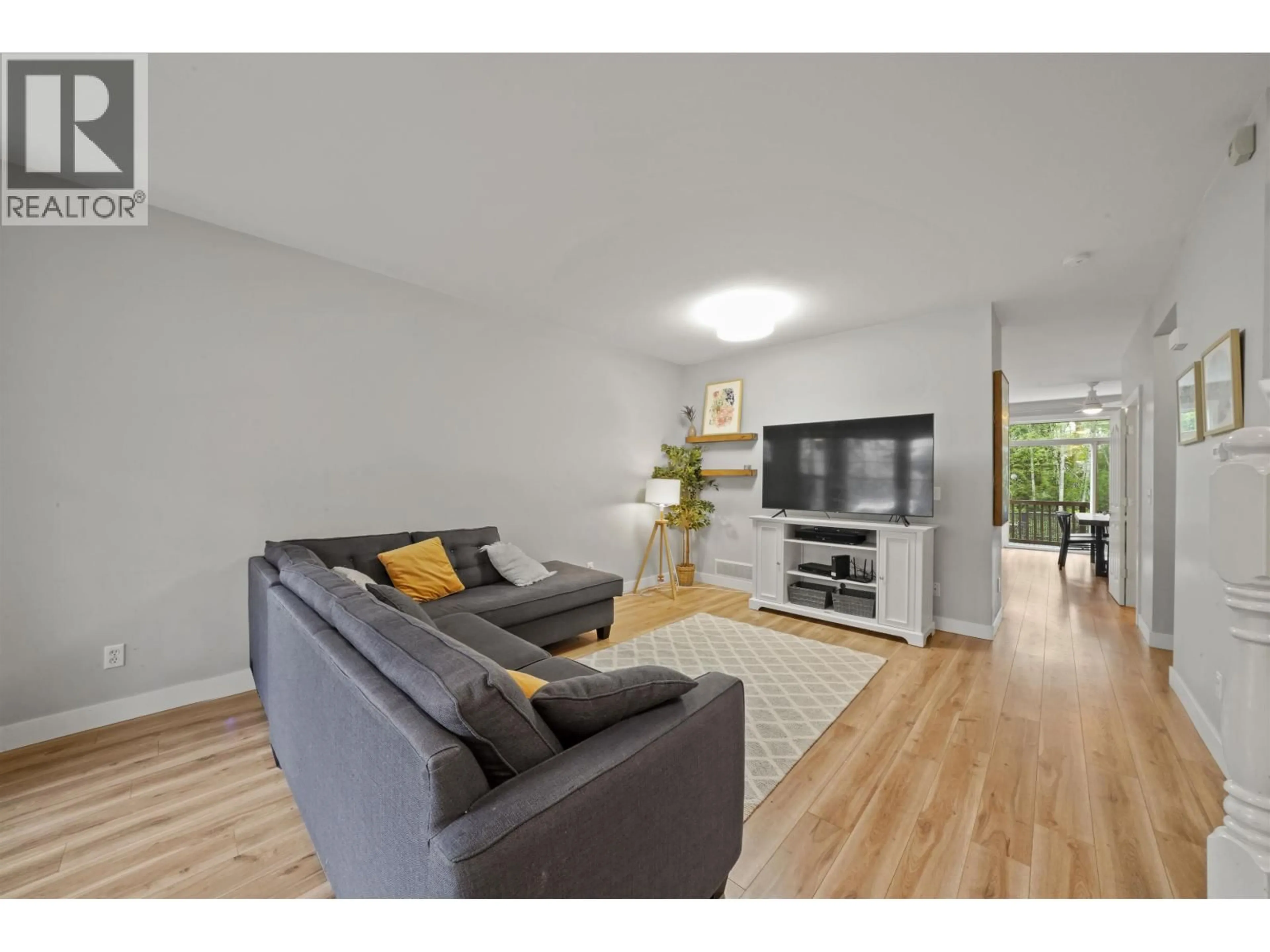 Living room with furniture, wood/laminate floor for 24369 101 AVENUE, Maple Ridge British Columbia V2W1W8