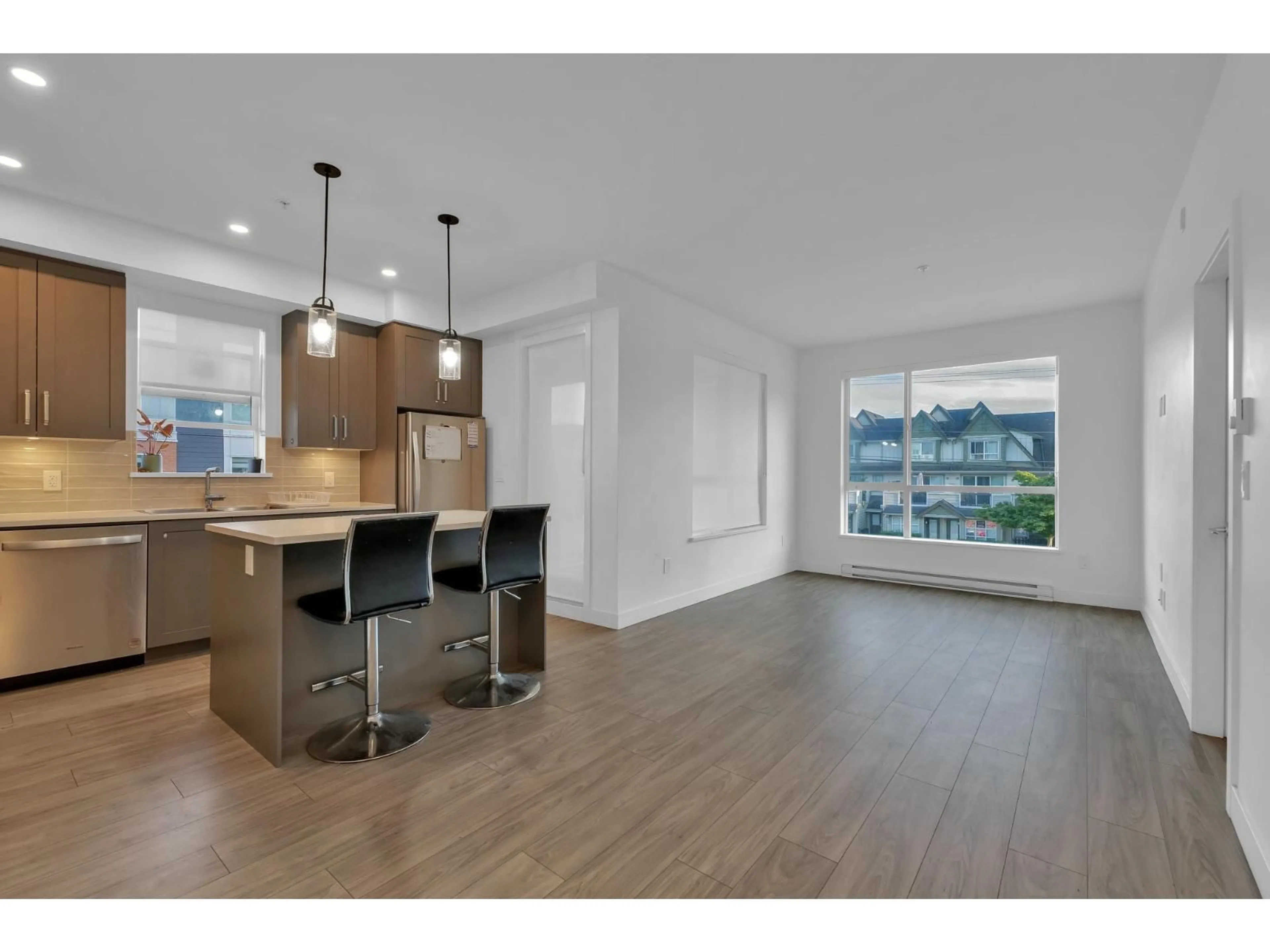 Open concept kitchen, wood/laminate floor for 214 - 18811 72 AVENUE, Surrey British Columbia V4N6W7