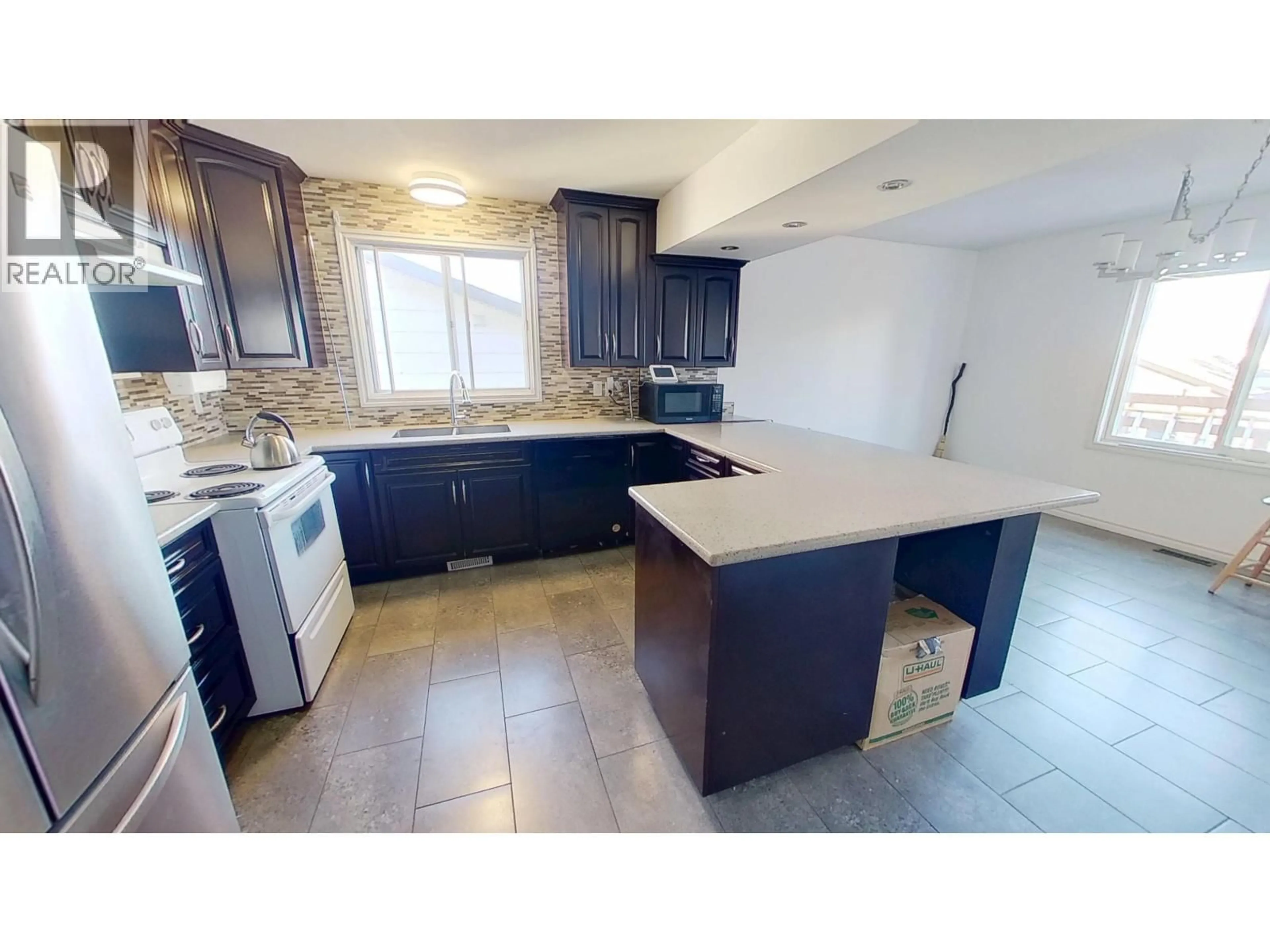 Open concept kitchen, ceramic/tile floor for 11015 102 STREET, Fort St. John British Columbia V1J4C2